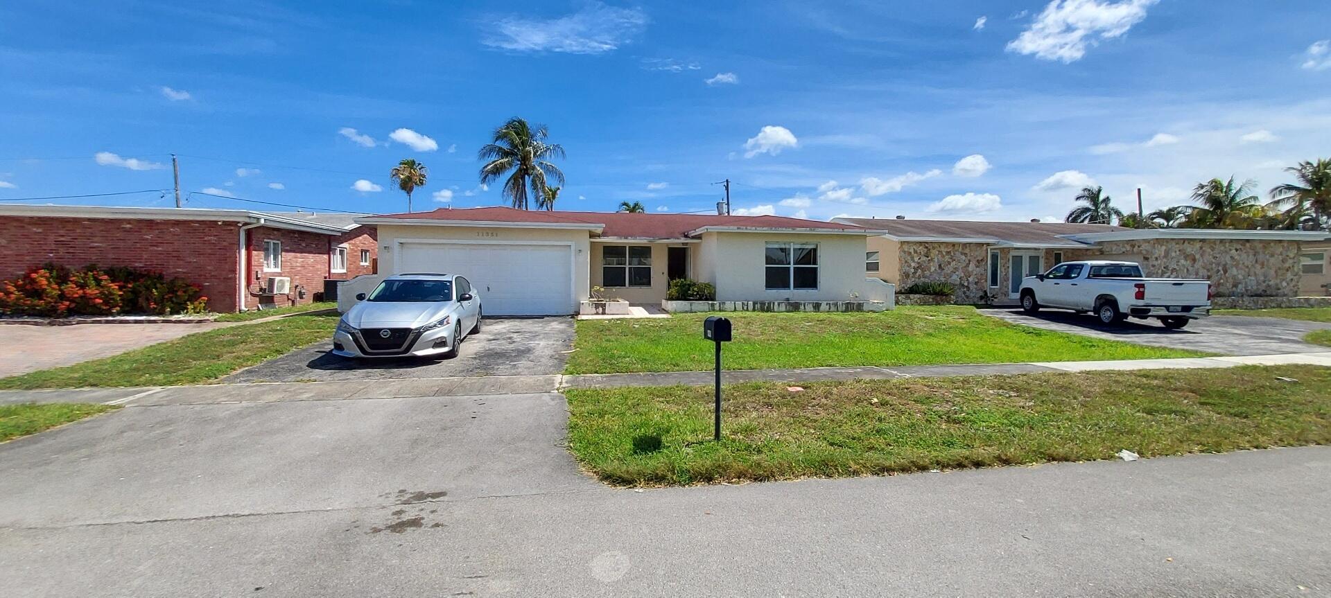 Foto de propiedad en 11351 NW 40th Place, Sunrise, FL 33323 Sunrise con MLS# 