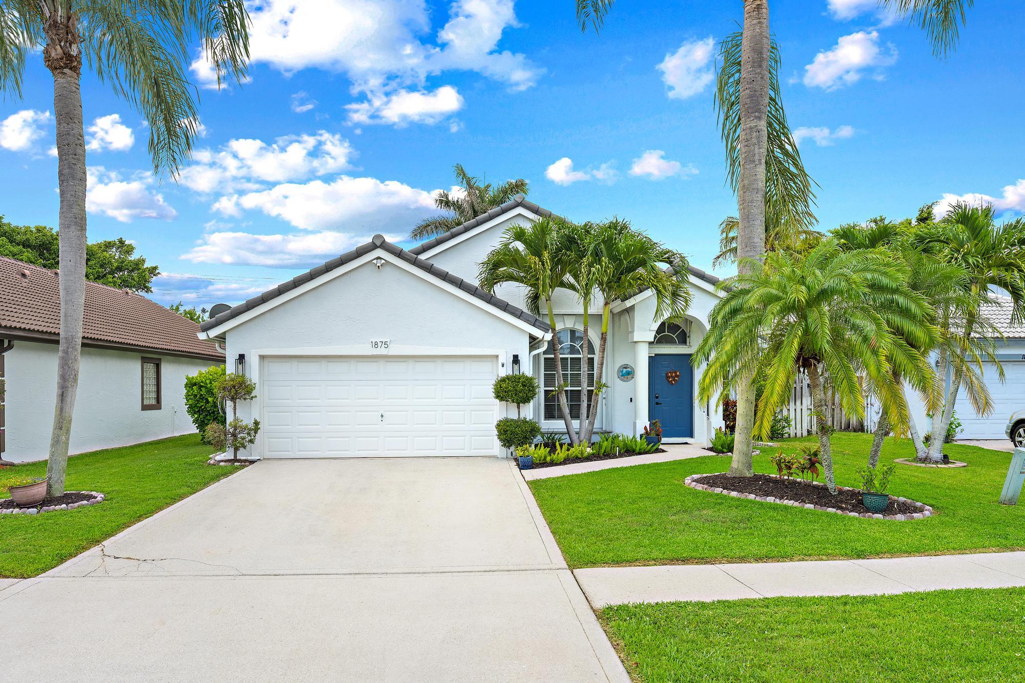 Foto de propiedad en 1875 Oak Berry Circle, Wellington, FL 33414 Wellington con MLS# 