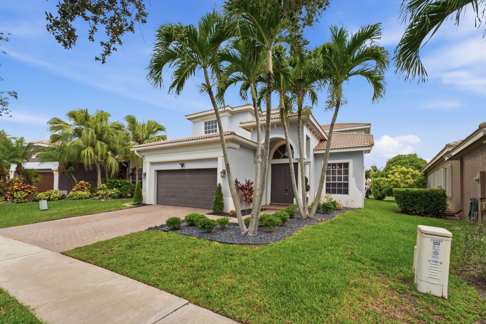 Foto de propiedad en 12339 NW 77th Manor, Parkland, FL 33076 Parkland con MLS# 