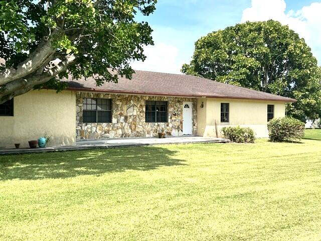 Foto de propiedad en 36911 3rd Street, Canal Point, FL 33438 Canal Point con MLS# 