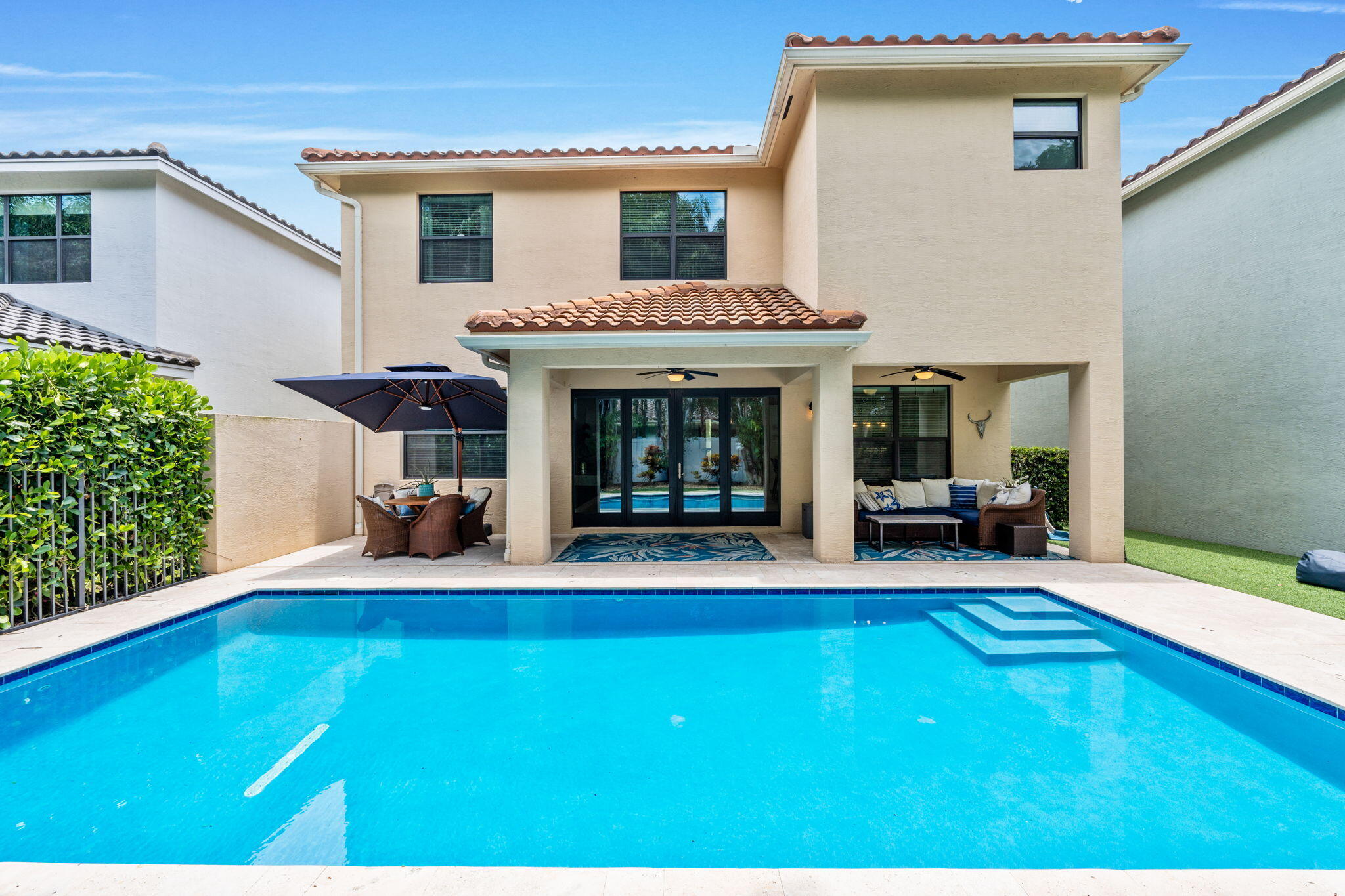 The "Verona" model BUT with a private pool with turf backyard