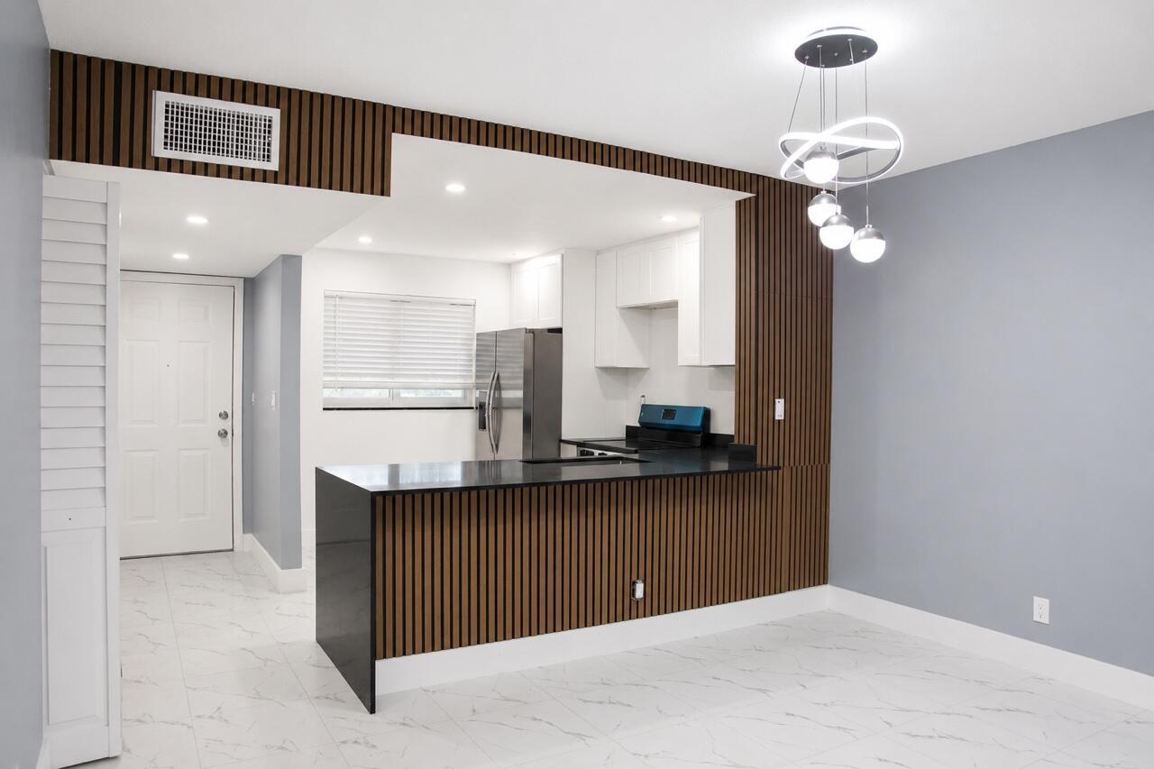 Foto de propiedad en 1103 NW 58TH Terrace 317, Sunrise, FL 33313 Sunrise con MLS# 