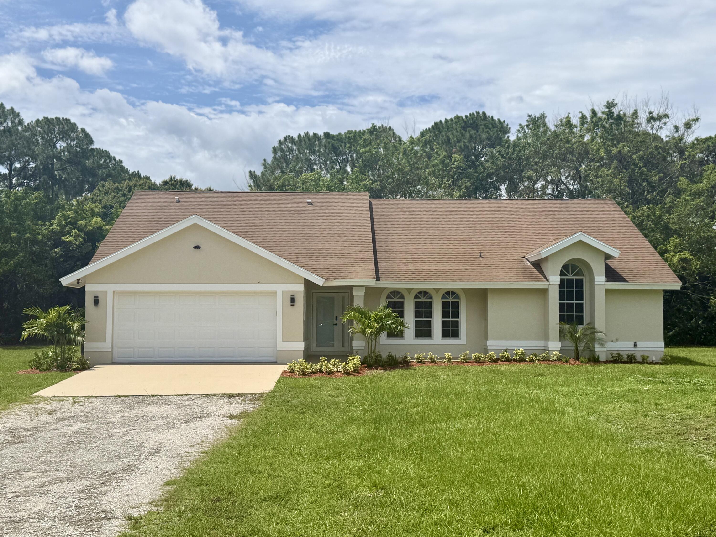 Foto de propiedad en 14618 63rd Court N, The Acreage, FL 33470 The Acreage con MLS# 