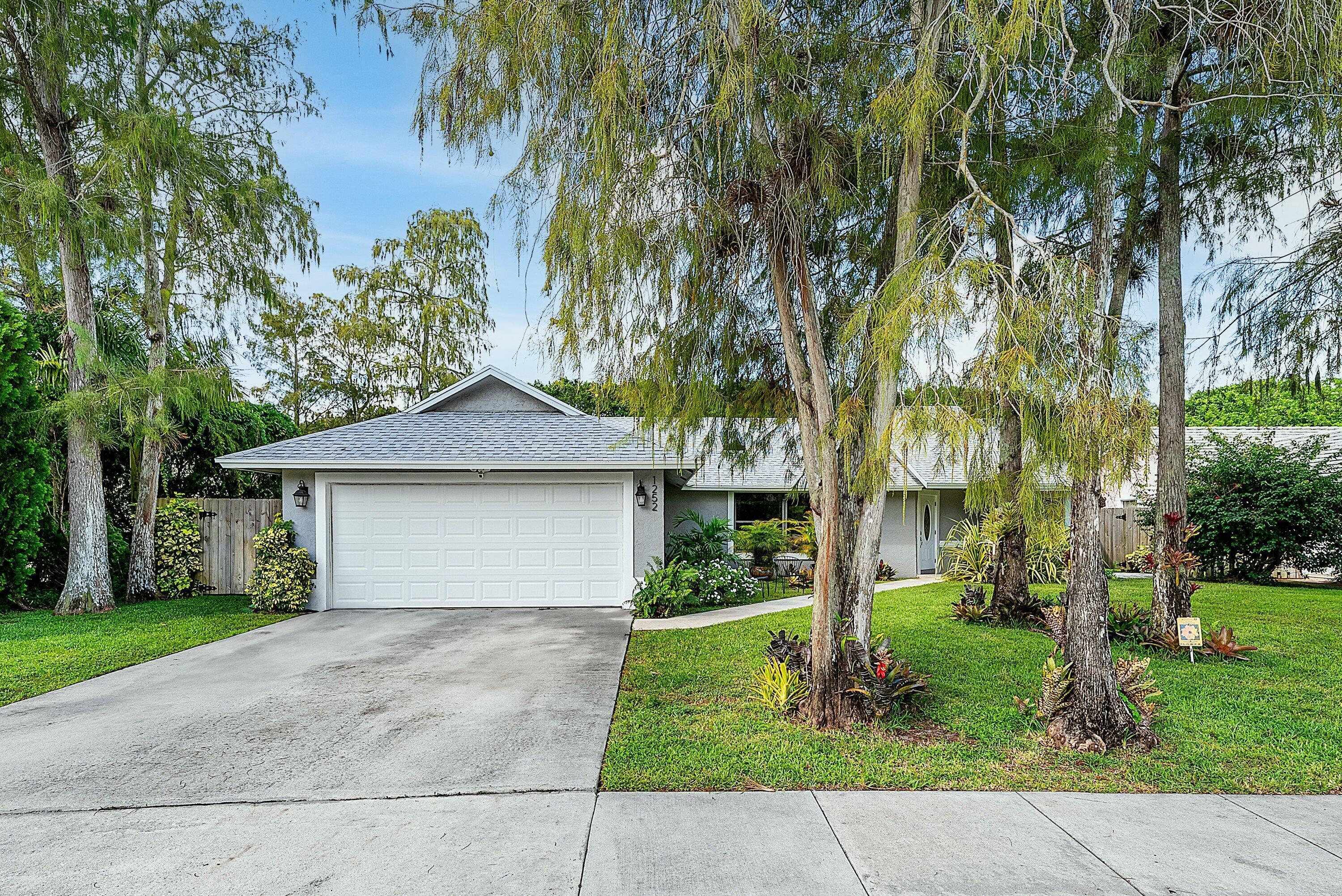 Foto de propiedad en 1252 Raintree Lane, Wellington, FL 33414 Wellington con MLS# 
