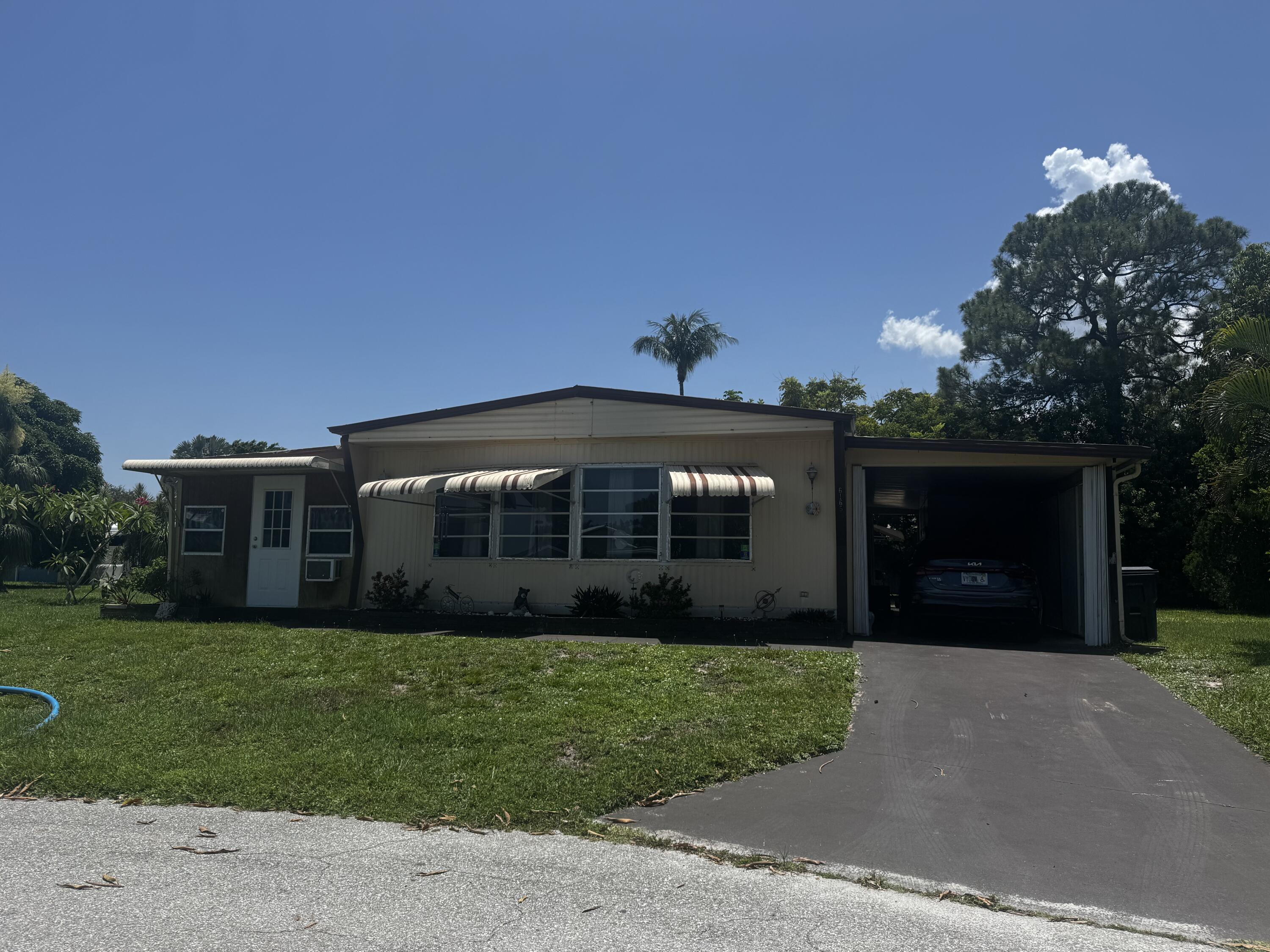 Foto de propiedad en 6165 N joshua Lane, Lantana, FL 33462 Lantana con MLS# 