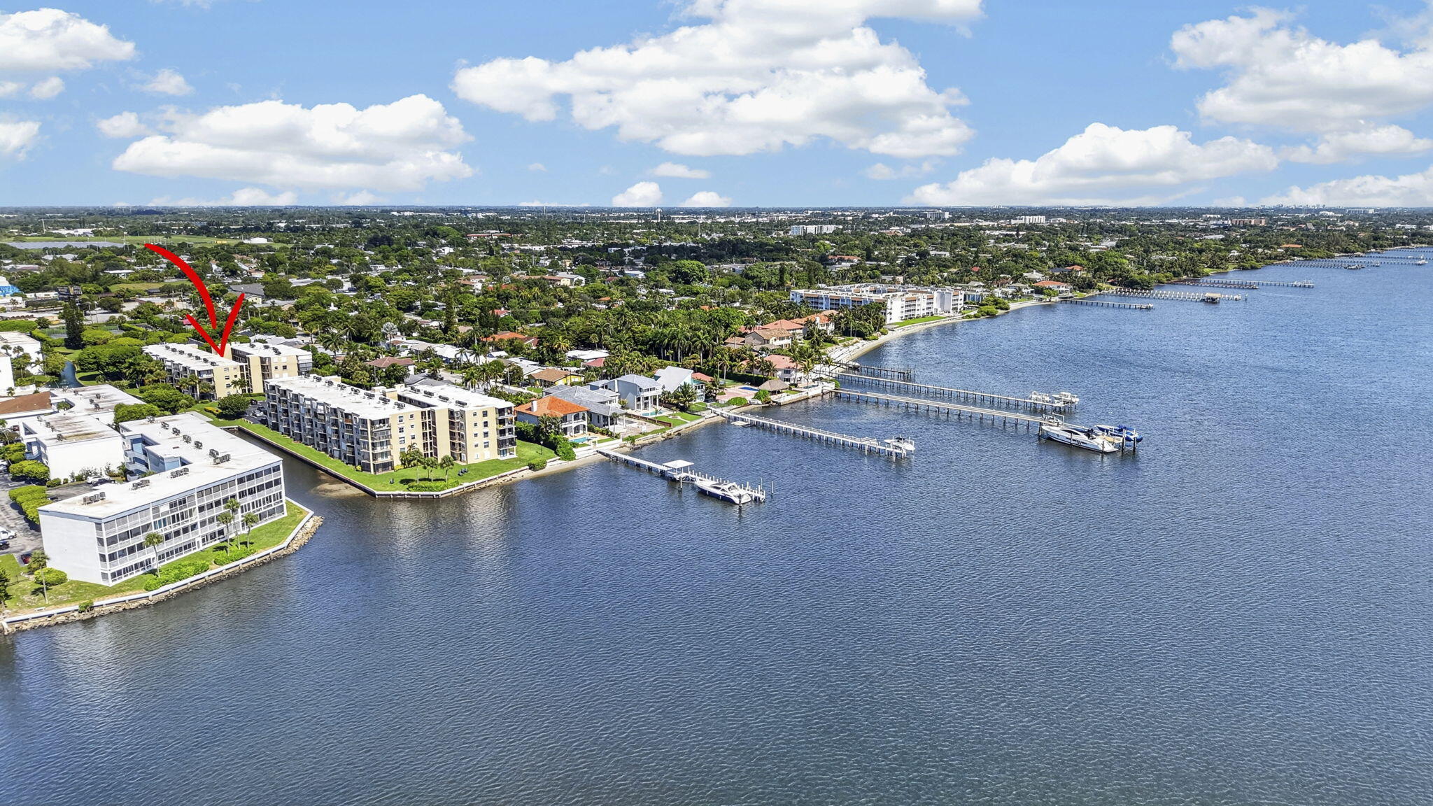 Waterfront condominium community featuring multiple buildings.