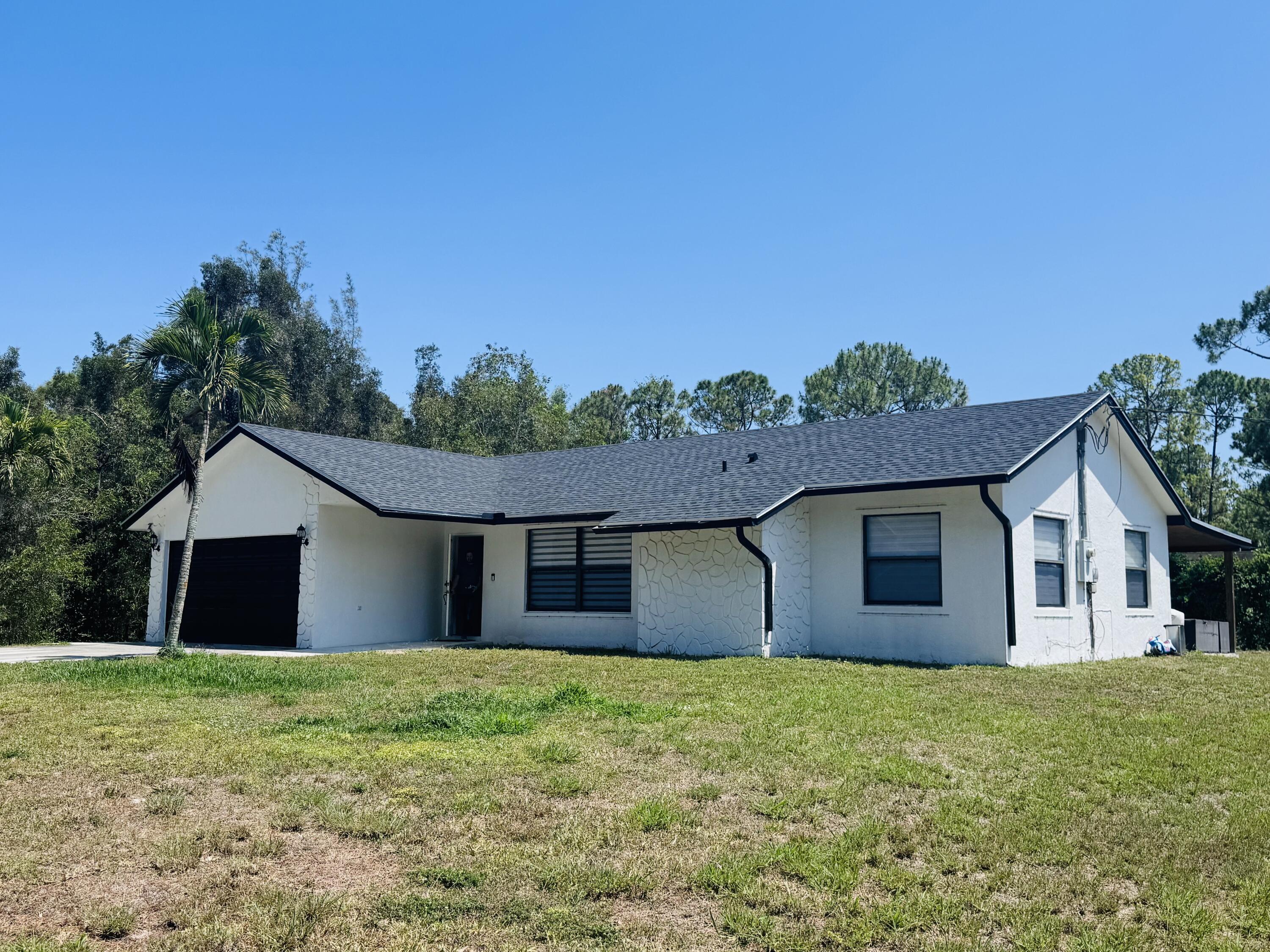 Foto de propiedad en 14196 N 77TH Place N, The Acreage, FL 33470 The Acreage con MLS# 