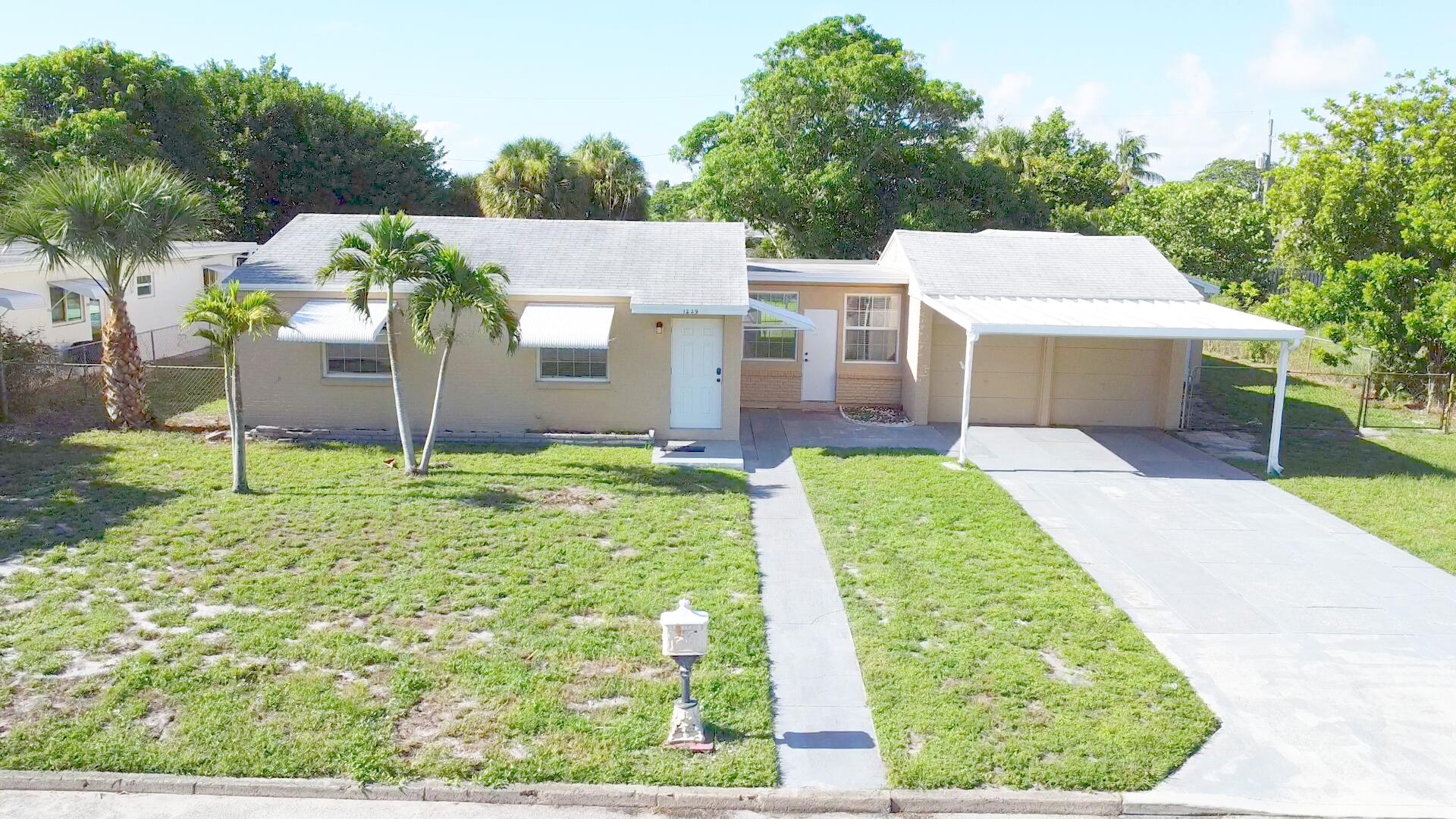 Foto de propiedad en 1229 15TH Avenue N, Lake Worth Beach, FL 33460 Lake Worth Beach con MLS# 