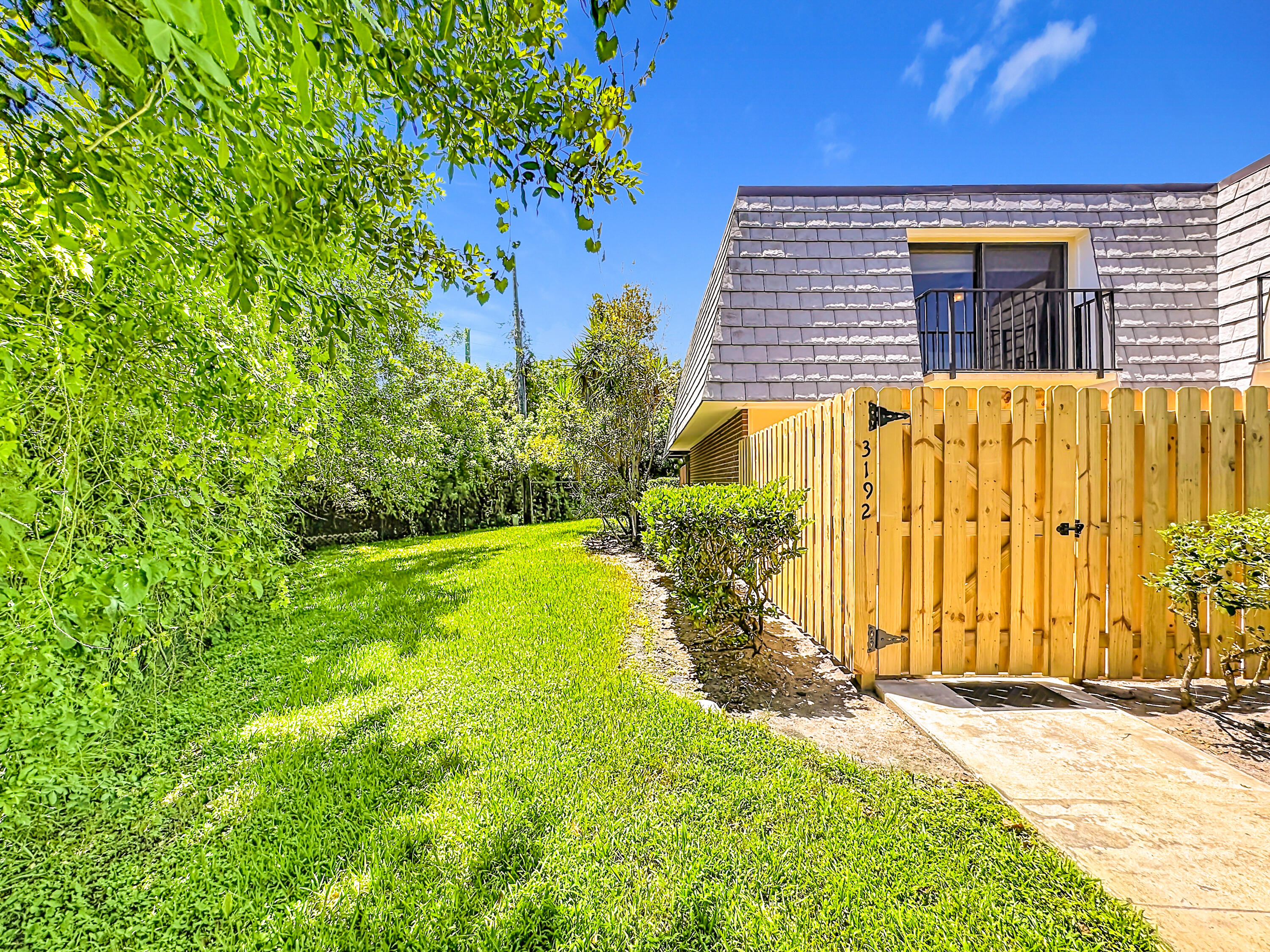 Newly fenced patio and backyard greenspace preserve