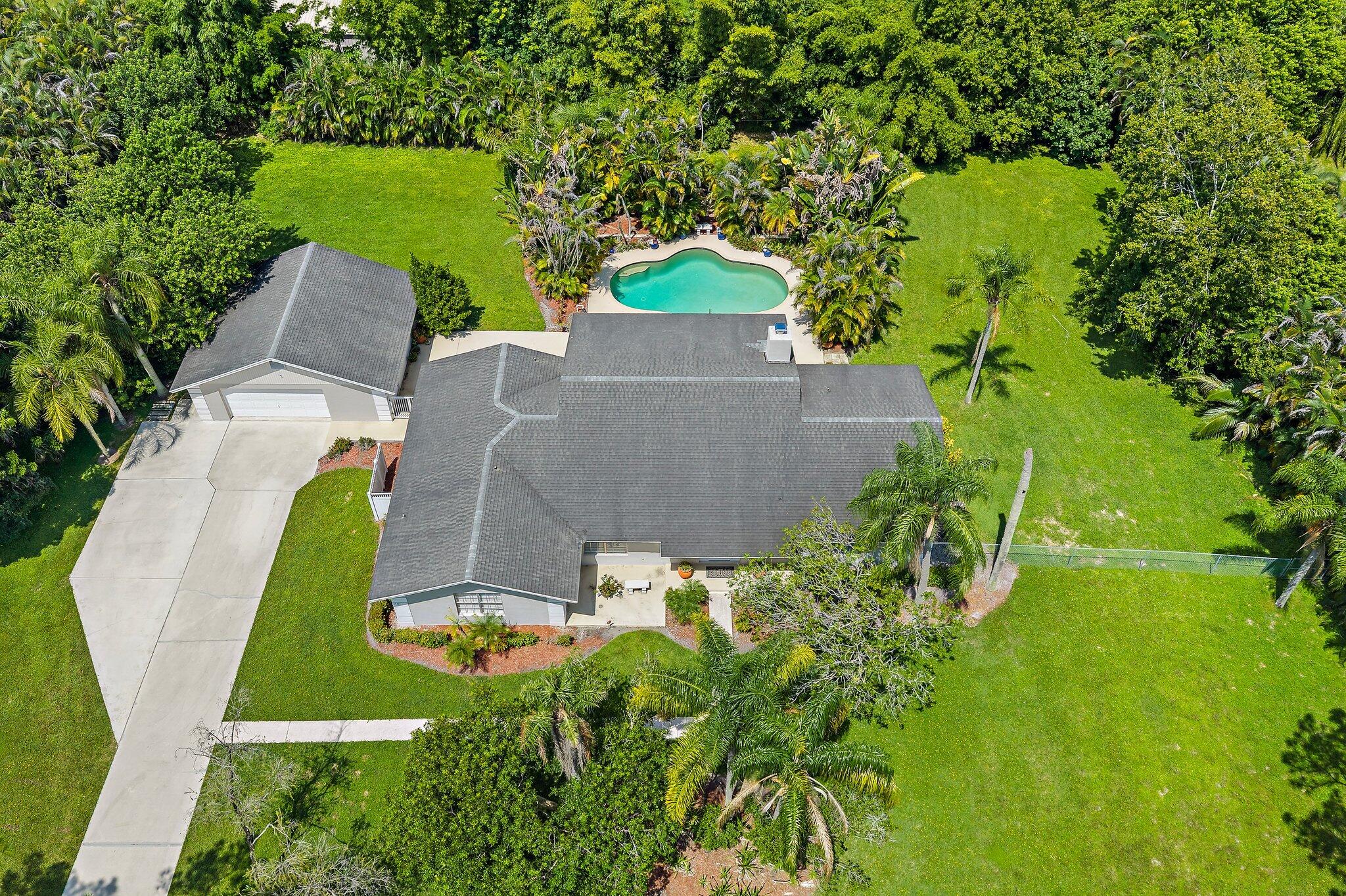 Enjoy 1.15 Acres of beautifully manicured grounds + Sunset Views!