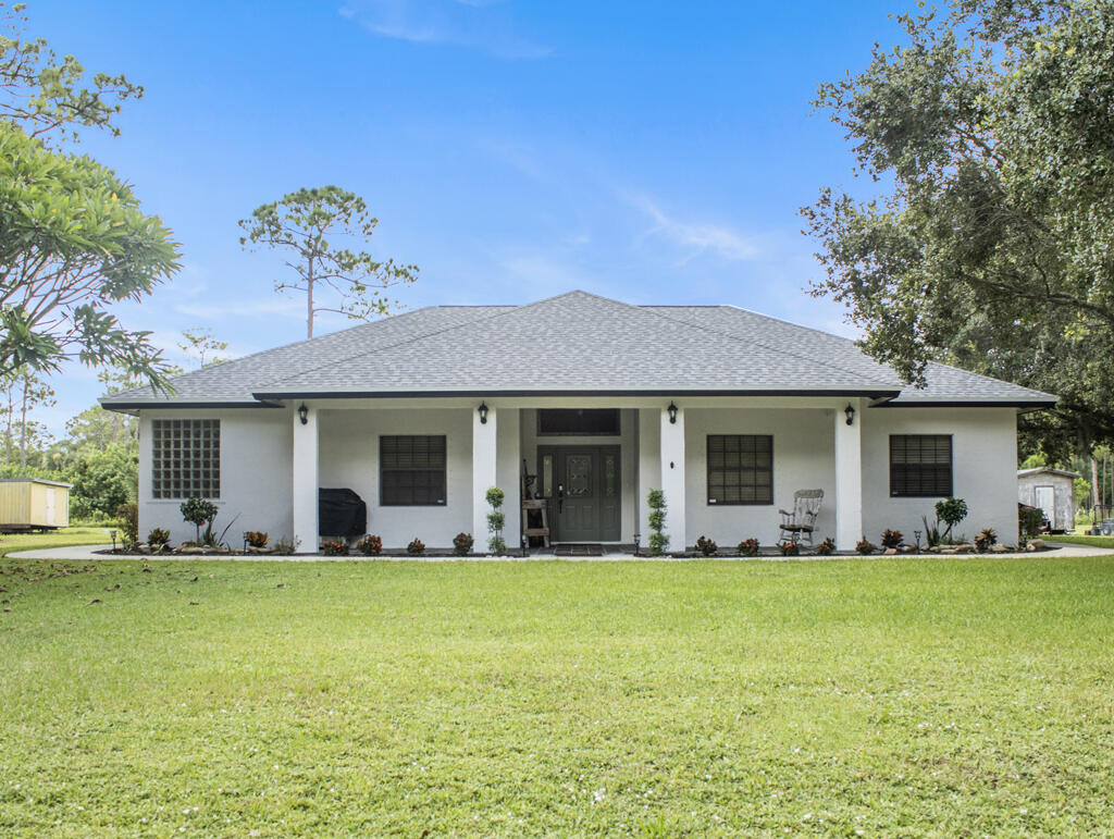 Foto de propiedad en 14662 78th Place N, Loxahatchee, FL 33470 Loxahatchee con MLS# 