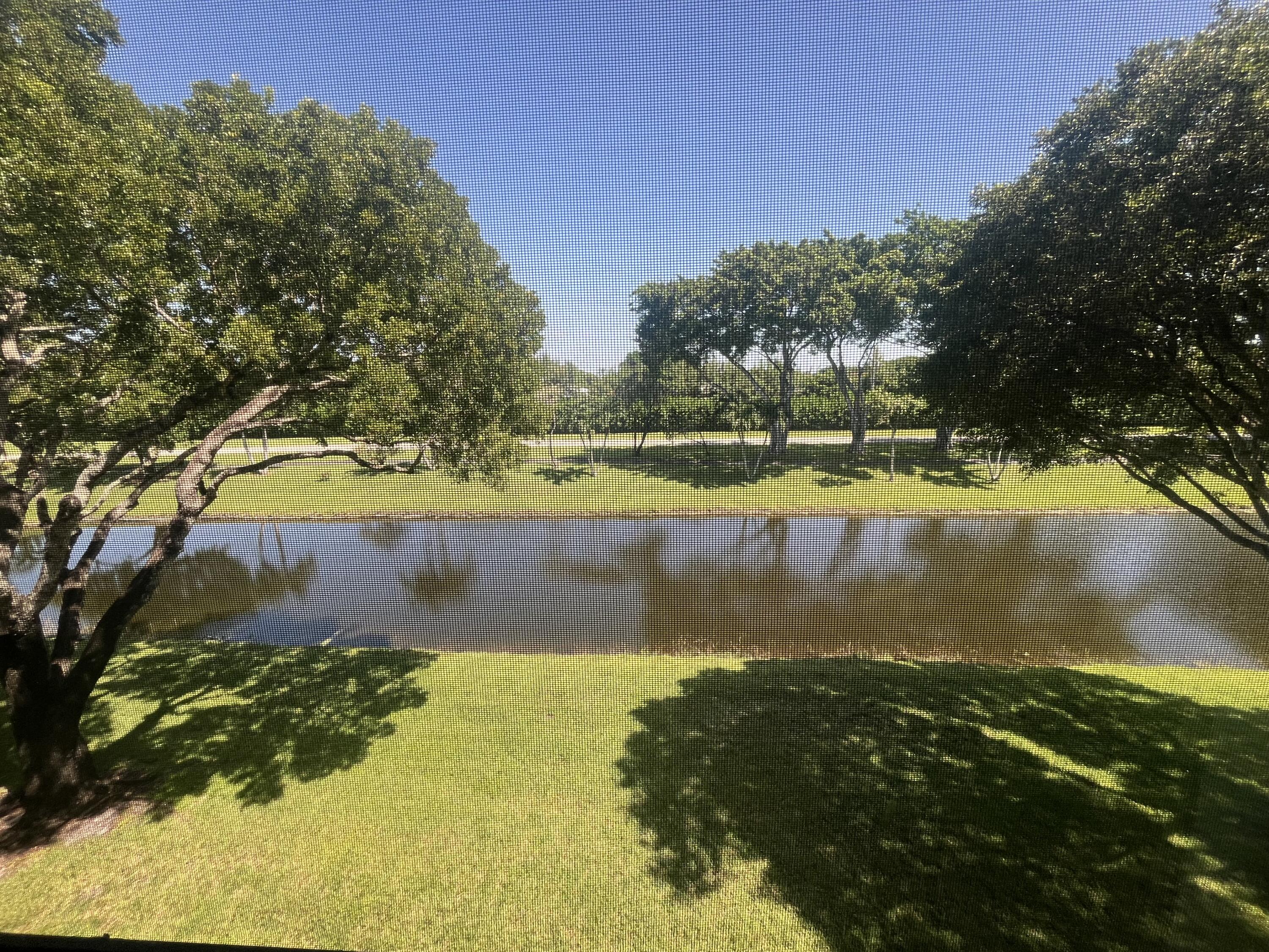 pond view from your screened in 23 X 6 patio facing north exposure (never any hot sun)