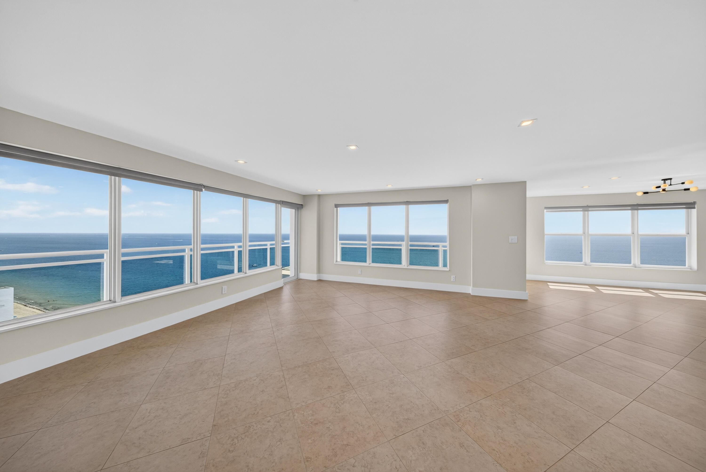 Sweeping ocean views from nearly every vantage point define this expansive northeast corner residence.