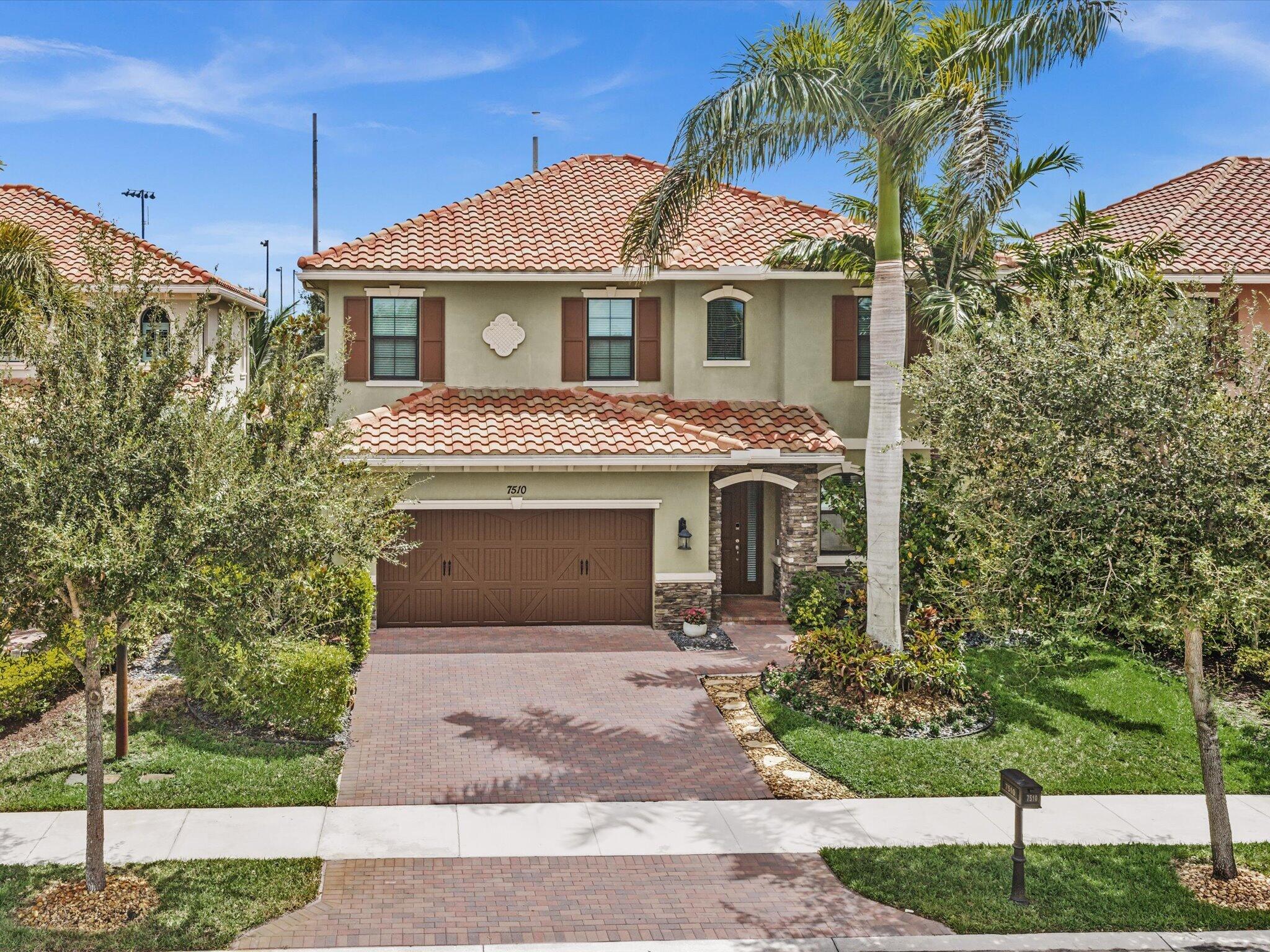 Foto de propiedad en 7510 NW 108th Avenue, Parkland, FL 33076 Parkland con MLS# 