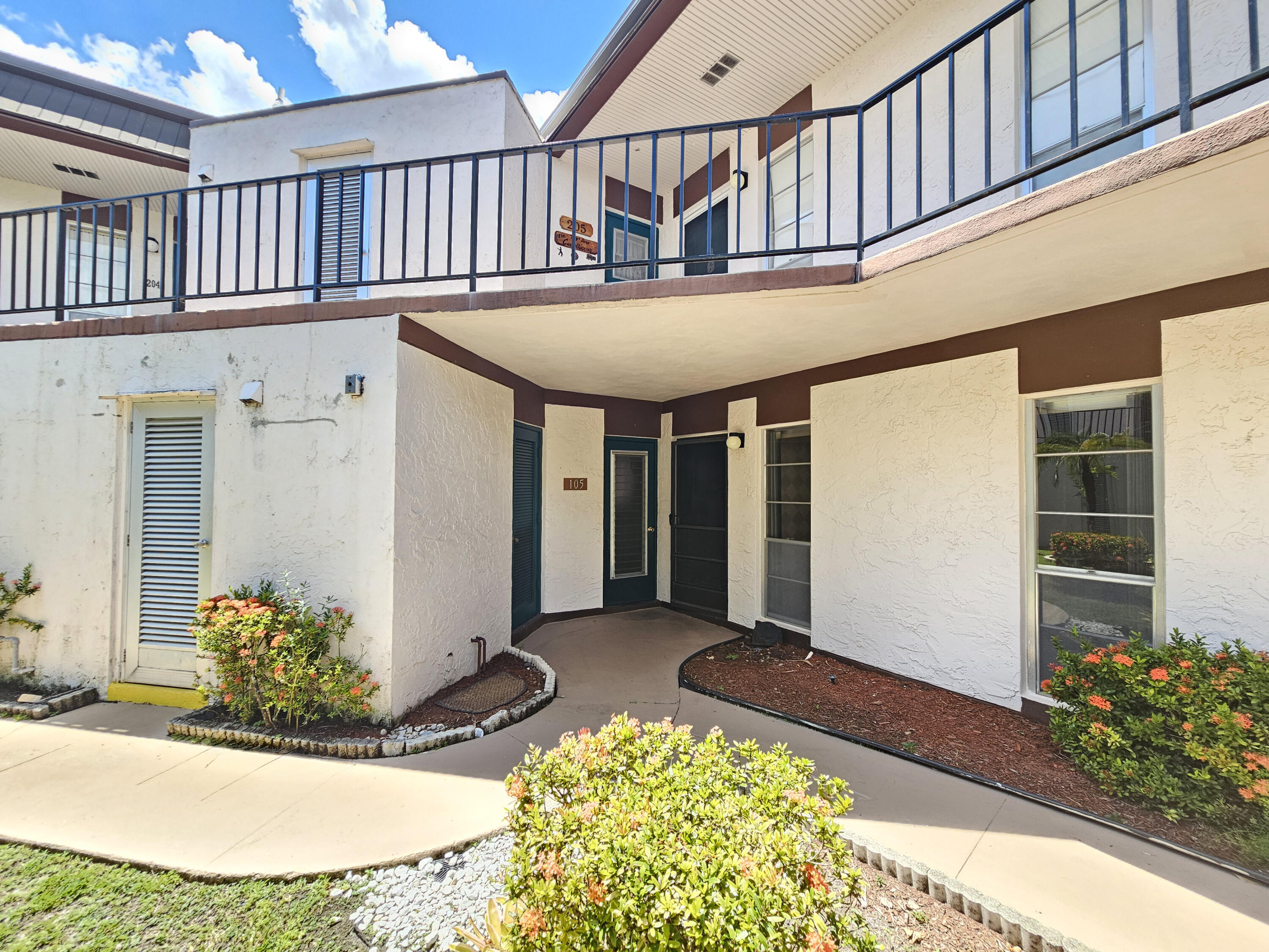 Foto de propiedad en 6 GREENWAY Village N 105, Royal Palm Beach, FL 33411 Royal Palm Beach con MLS# 