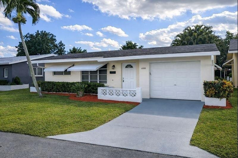 Foto de propiedad en 4906 NW 53RD Court, Tamarac, FL 33319 Tamarac con MLS# 