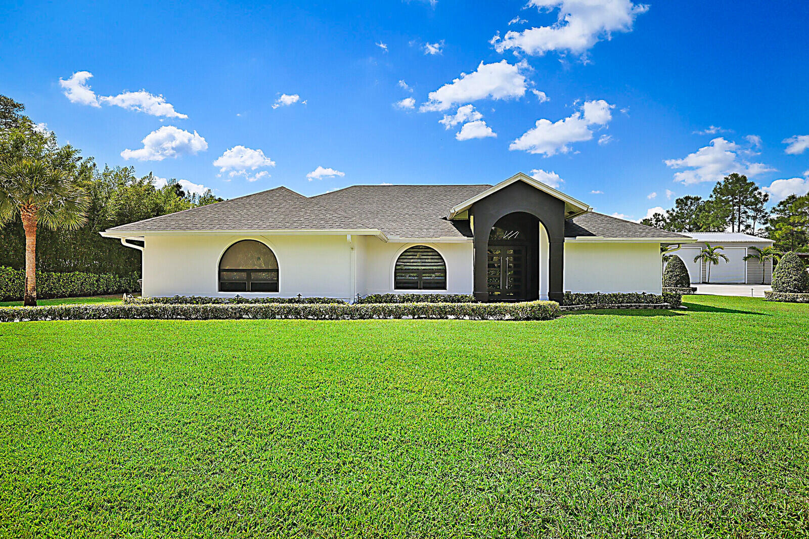 Foto de propiedad en 16966 91ST Place N, The Acreage, FL 33470 The Acreage con MLS# 