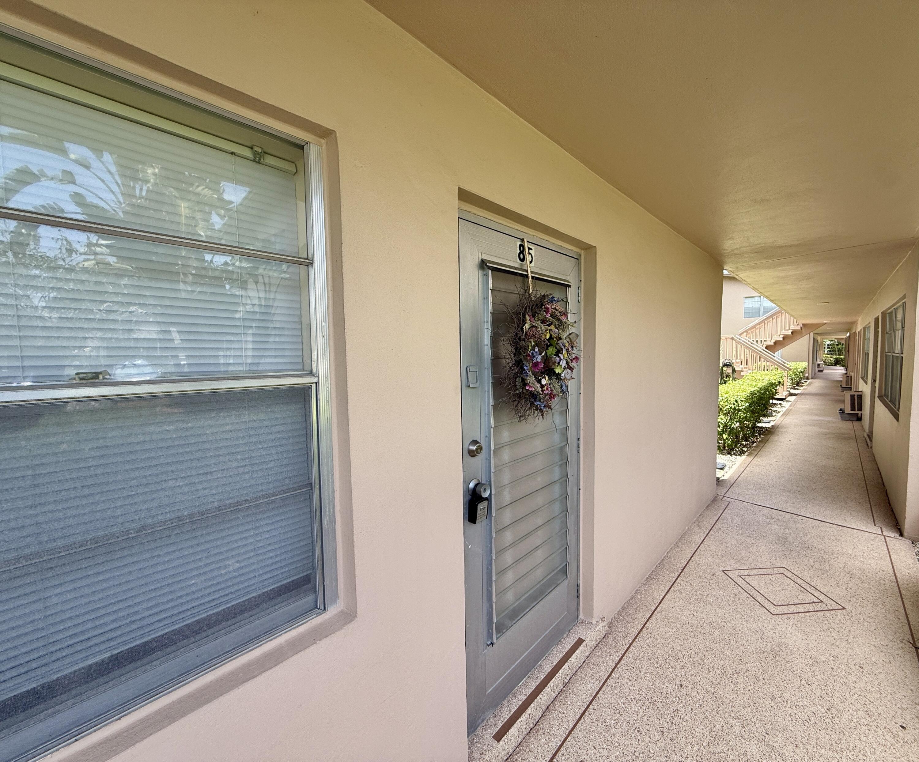 Desirable Location! First Floor CORNER With Updates to Flooring, Kitchen & Baths!