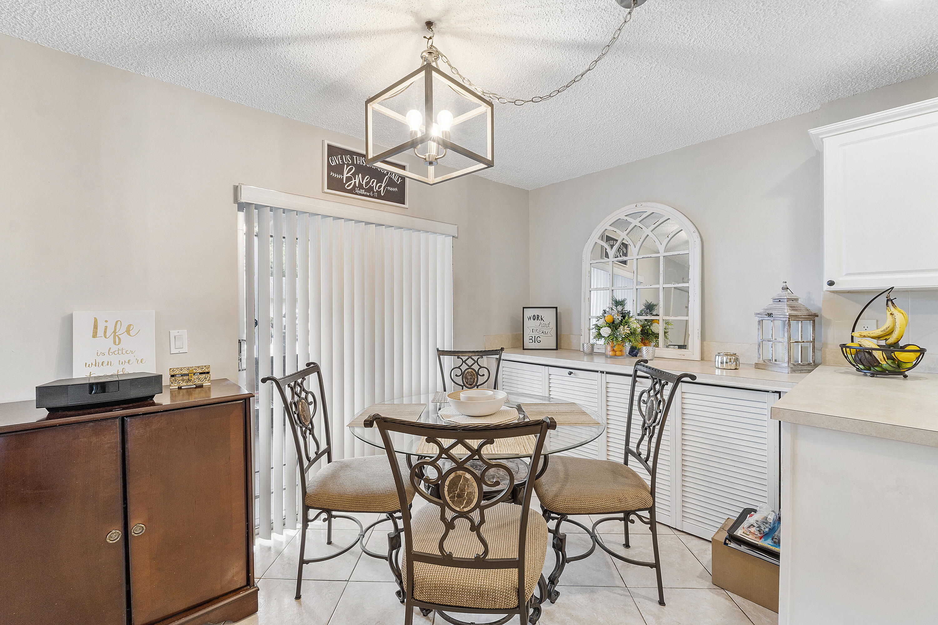 Open Kitchen with sliders to porch , plenty of storage closets extended island.