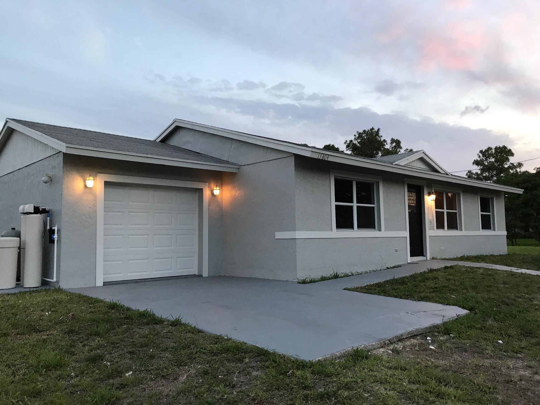 Foto de propiedad en 13304 62ND Court N, The Acreage, FL 33412 The Acreage con MLS# 