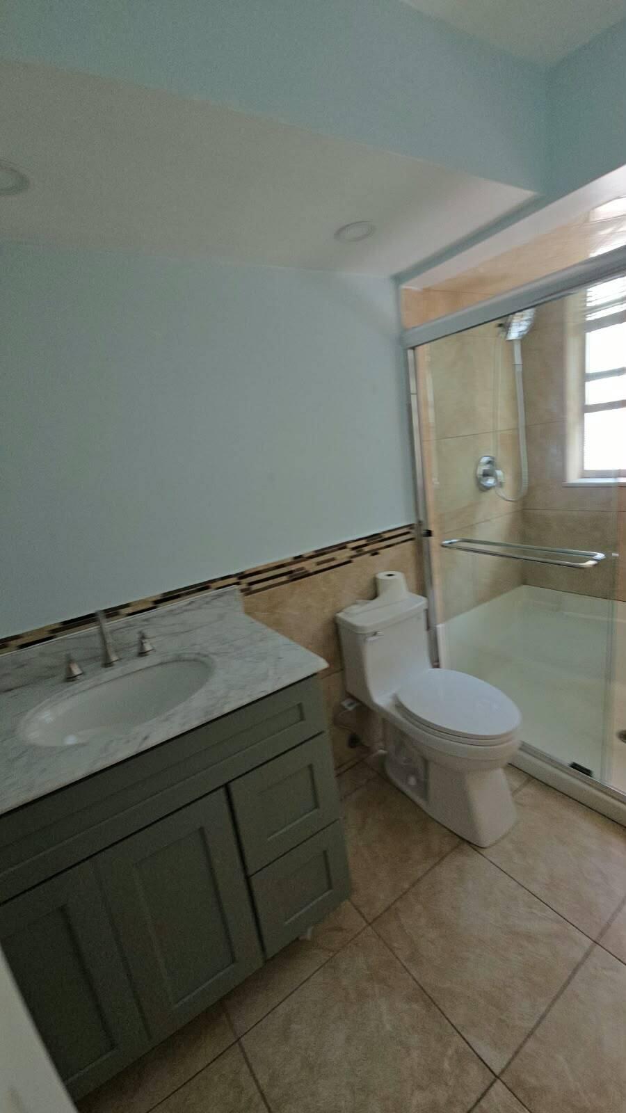 Vanity with undermount sink, marble countertop, and chrome faucet