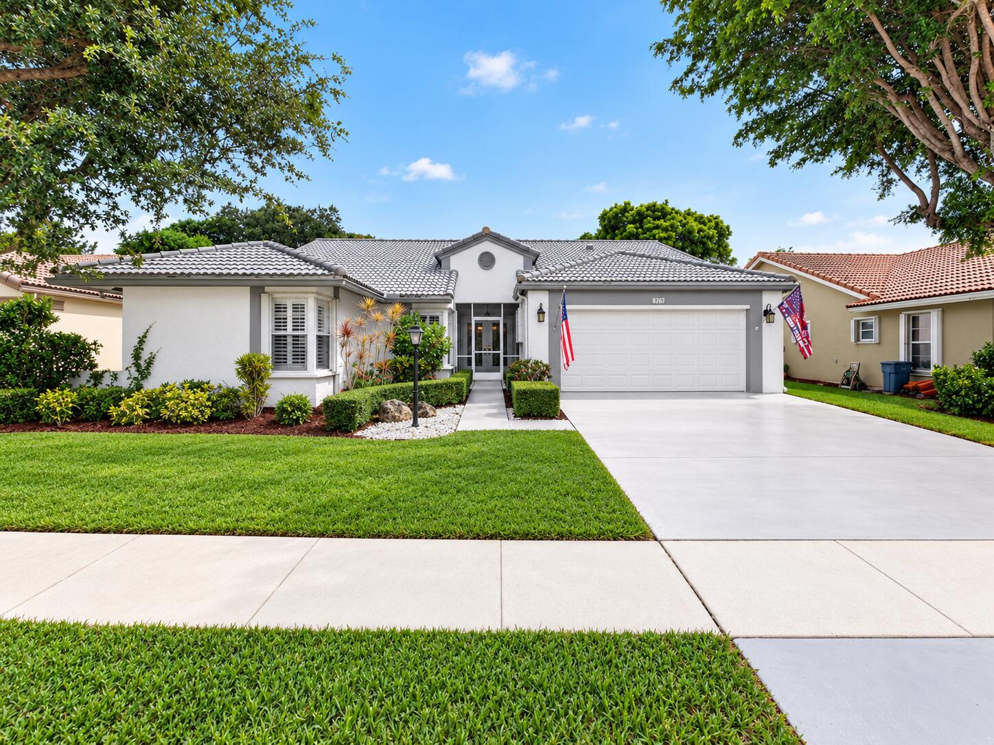Inviting front exterior with well-maintained landscaping