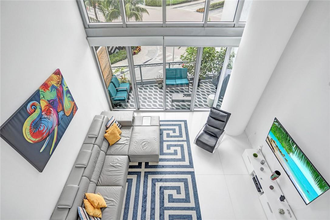Soaring ceilings, dramatic open spaces, and the vibrant energy of Brickell just moments away. This stunning two-story loft offers the perfect blend of urban sophistication and lifestyle appeal, whether you're searching for a place to call home or an exceptional investment opportunity.