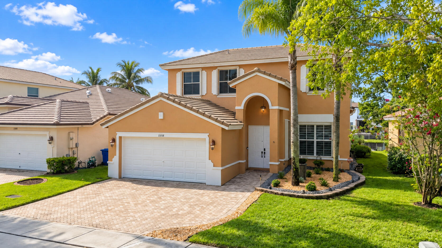 4-bedroom, 2.5-bath lakefront home features high ceilings, abundant natural light, engineered hardwood flooring. 2025 roof and accordion hurricane shutters.