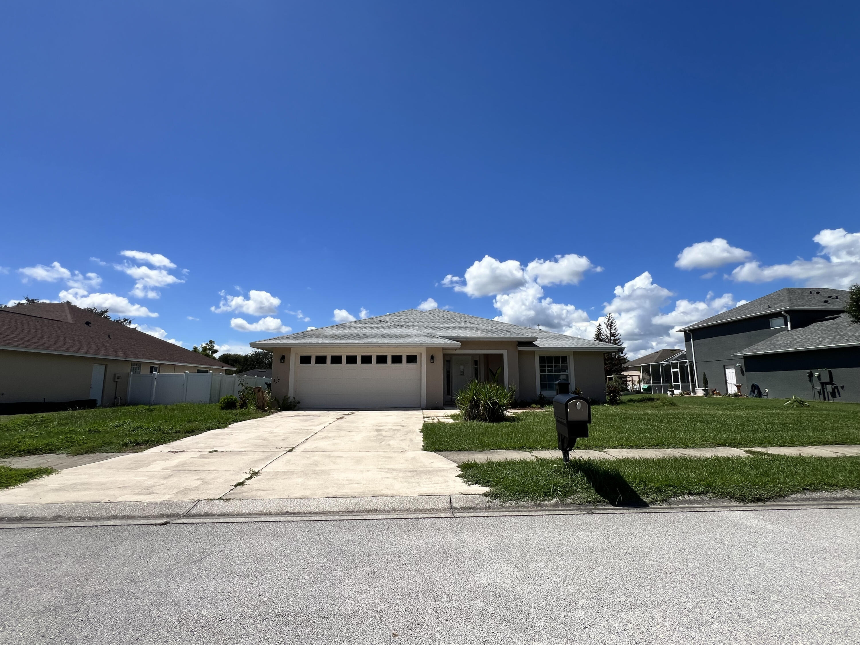 Attached two-car garage with panel windows