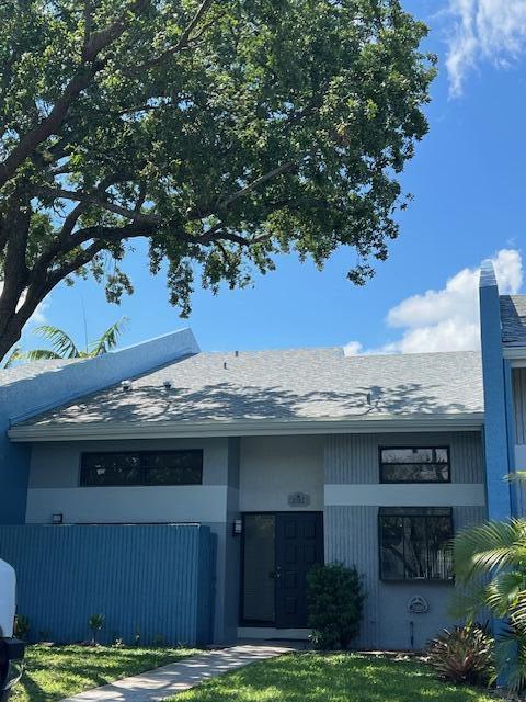 Freshly painted exterior, 2024 roof and 2 assigned spaces directly in front of the unit.