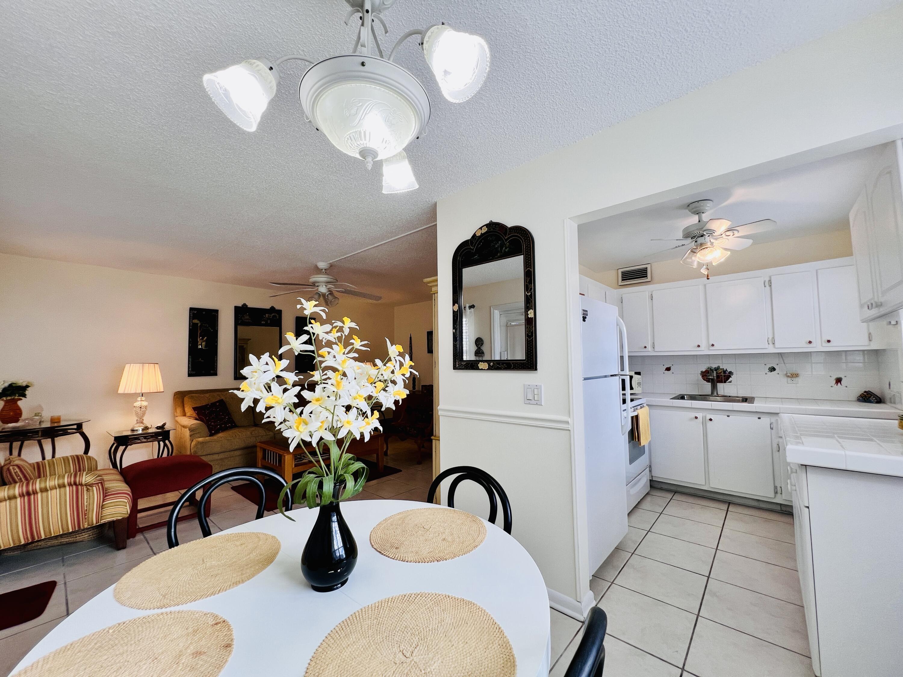 LOCATION - LOCATION - LOCATION!!! Elegant 2/1.5 First Floor CORNER With Pretty Water Views! (Sold Unfurnished)