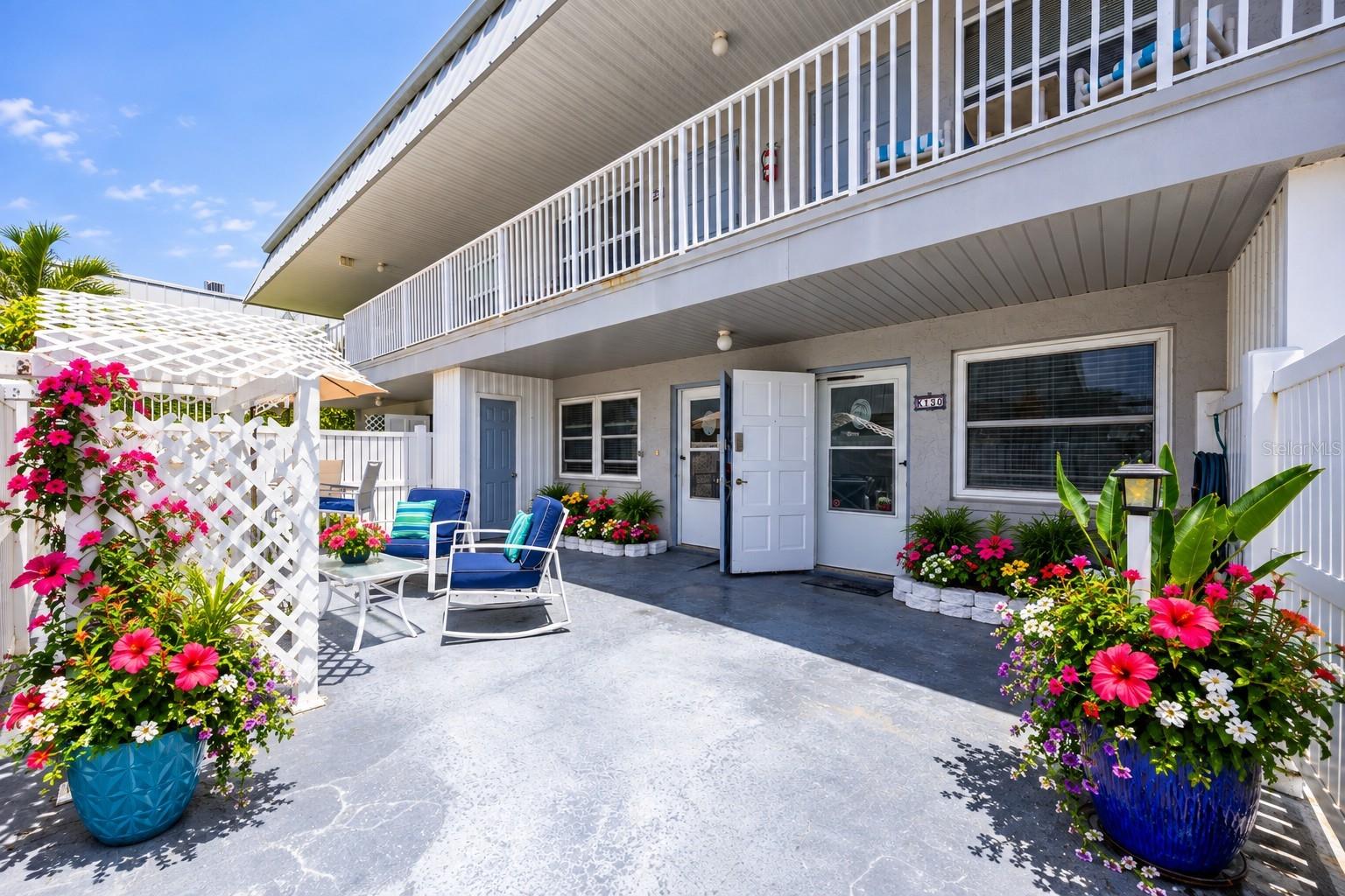 digitally staged ~ front of the unit/courtyard