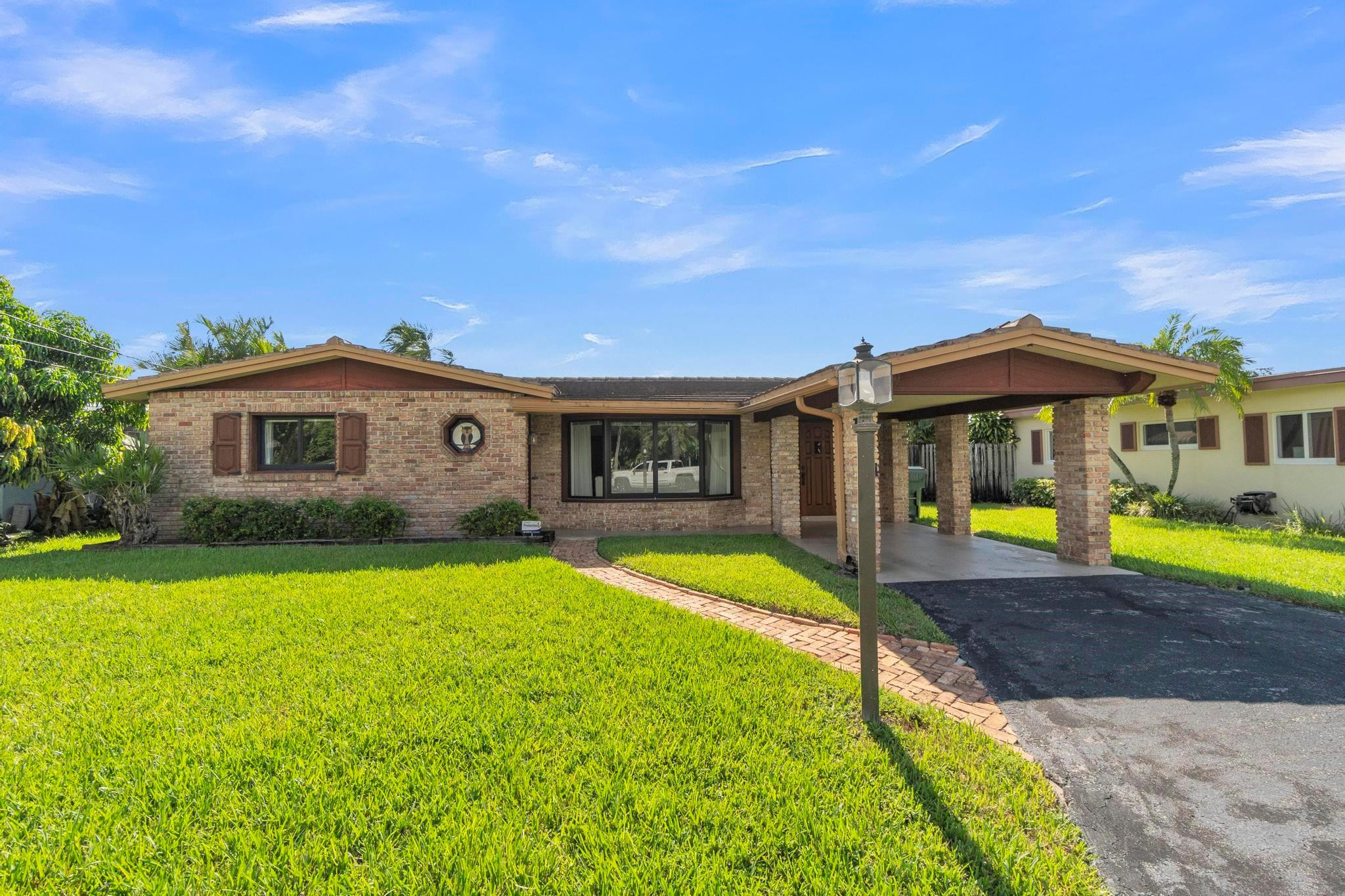 Foto de propiedad en 1774 NW 39th Place, Oakland Park, FL 33309 Oakland Park con MLS# 