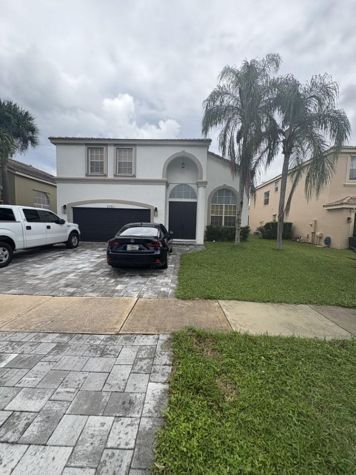 Foto de propiedad en 2761 Misty Oaks Circle, Royal Palm Beach, FL 33411 Royal Palm Beach con MLS# 