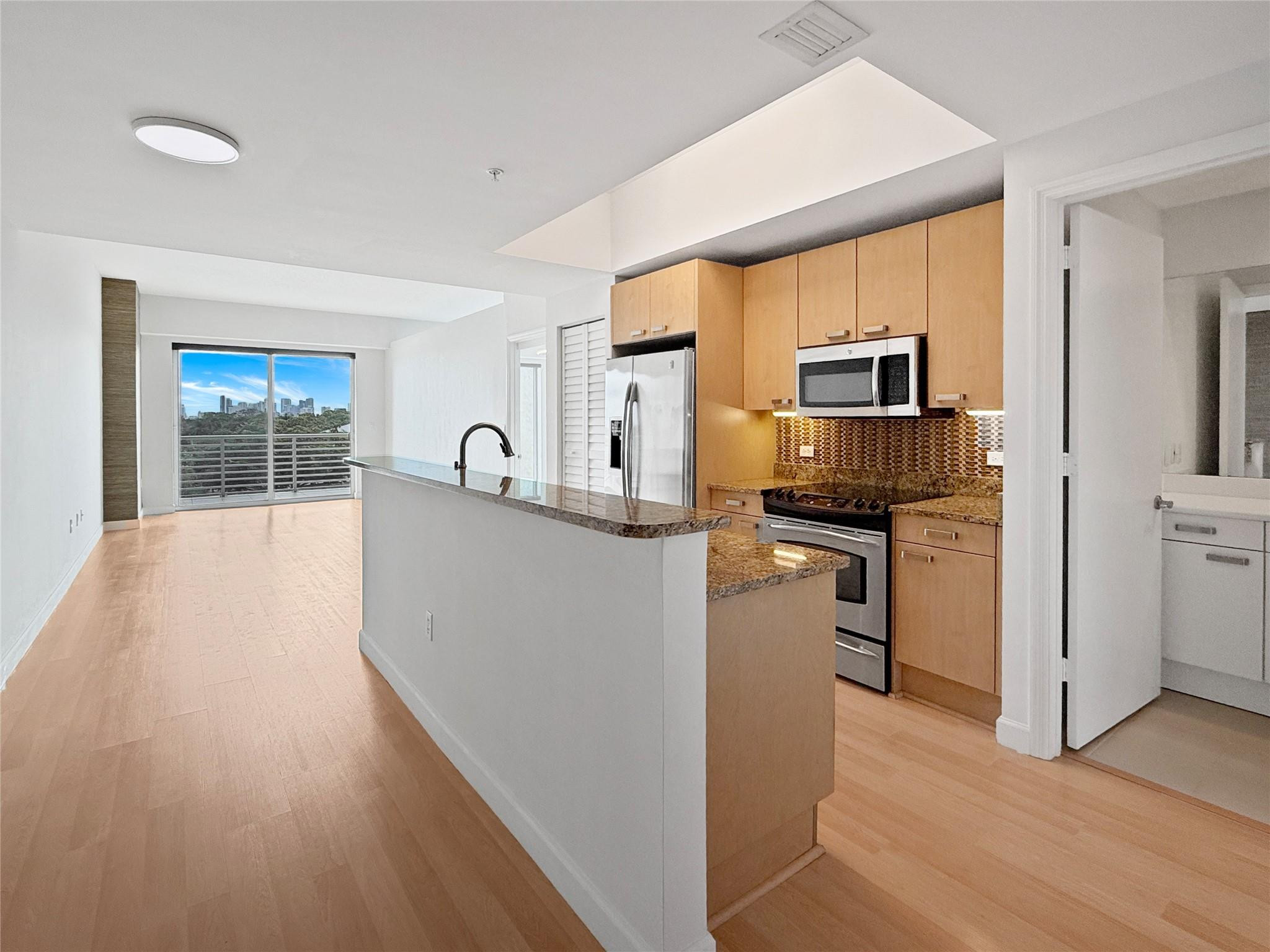 Open floor plan with powder room to right.