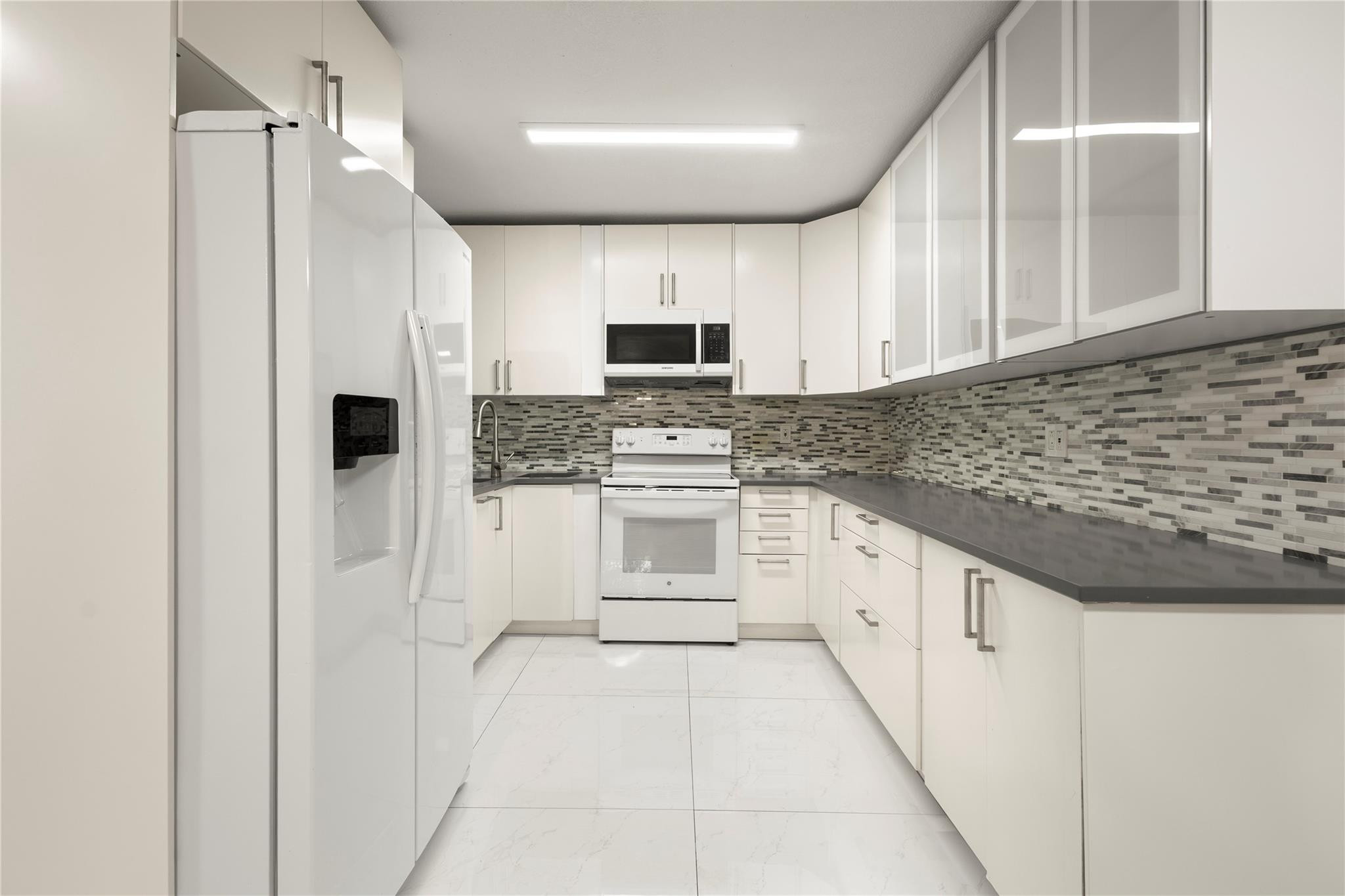Beautiful remodeled kitchen, quartz countertop, full-height cabinets