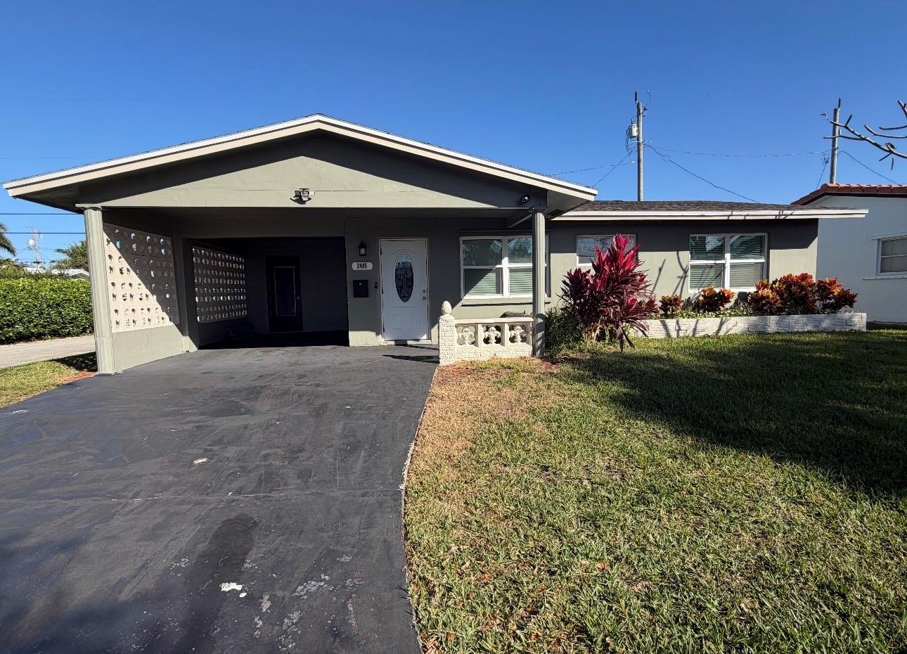 Foto de propiedad en 2405 NW 54th Street, Tamarac, FL 33309 Tamarac con MLS# 