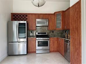 Foto de propiedad en 9880 Red Heart Lane, Tamarac, FL 33321 Tamarac con MLS# 