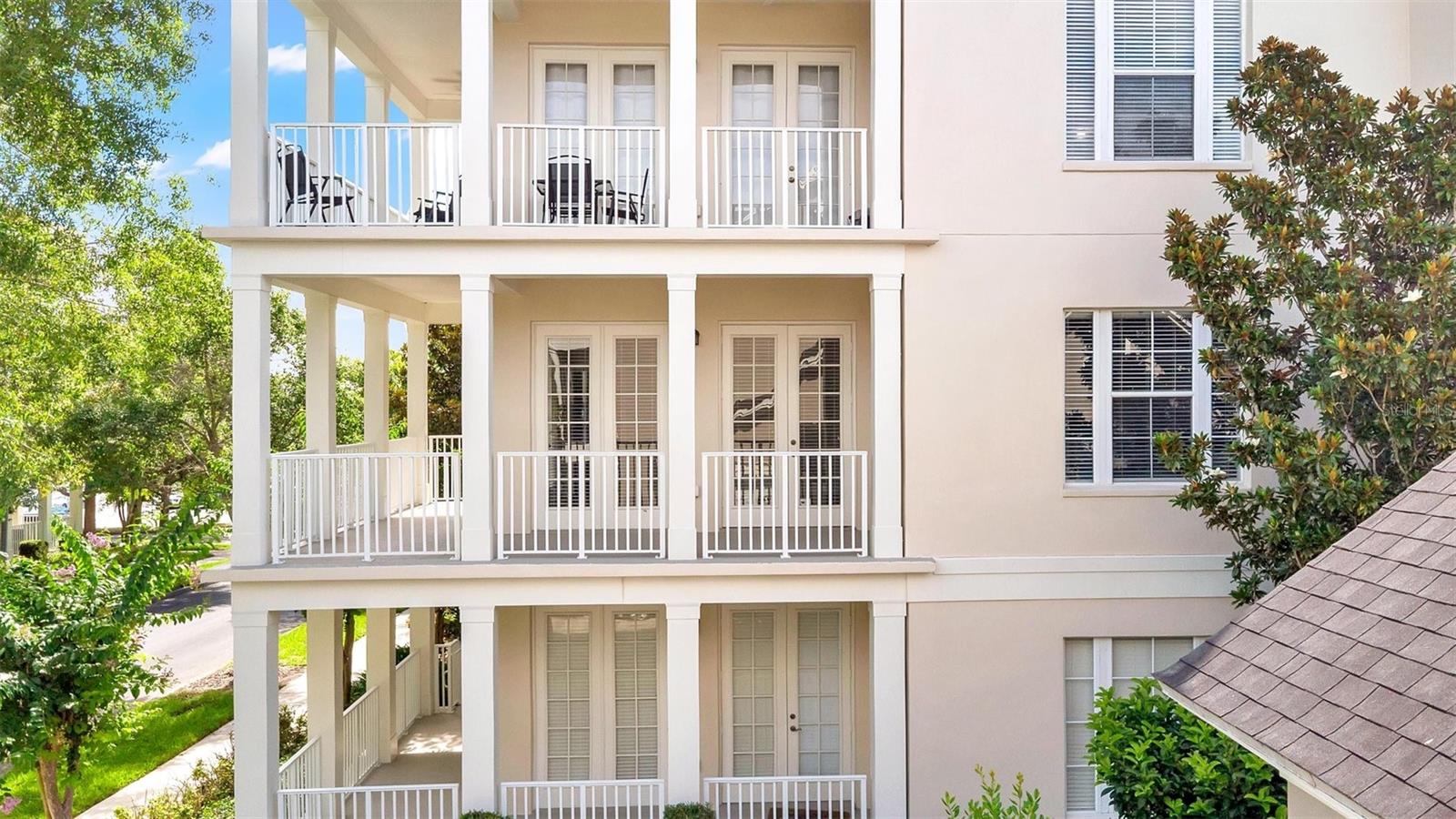 Home located on second floor with elegant wrap-around porch