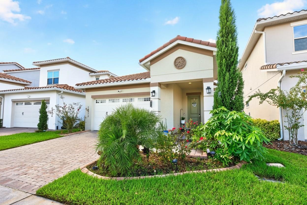 2022 BUILT, single story home with ***PAID-OFF SOLAR***, SUMMER KITCHEN & FENCED BACKYARD in the sought-after 24 HOUR GUARD GATED Eagle Creek golf community of Lake Nona!