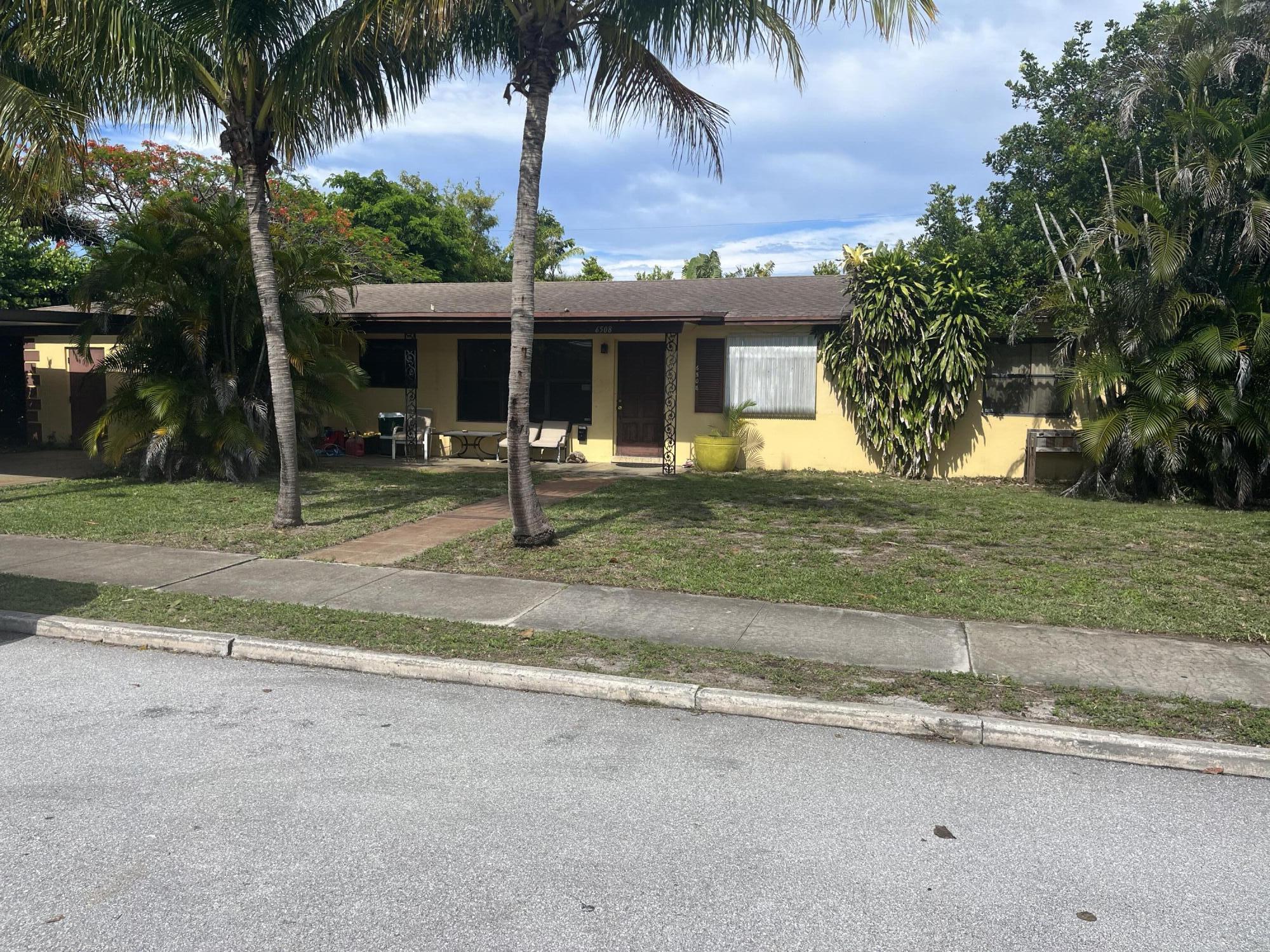 Foto de propiedad en 6508 Washington Road, West Palm Beach, FL 33405 West Palm Beach con MLS# 