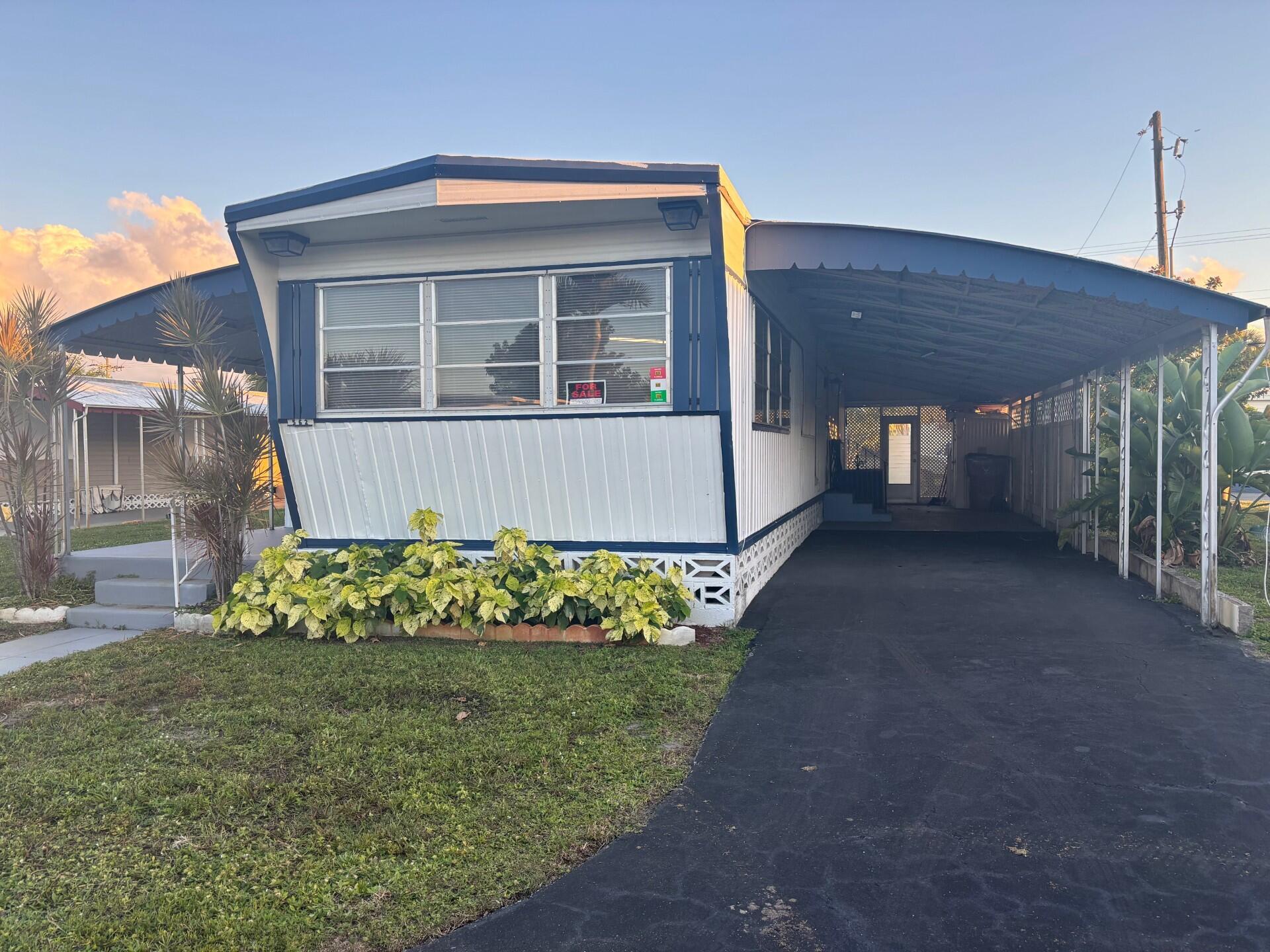 Foto de propiedad en 562 NE 47th St, Lot 393, Deerfield Beach, FL 33064 Deerfield Beach con MLS# 
