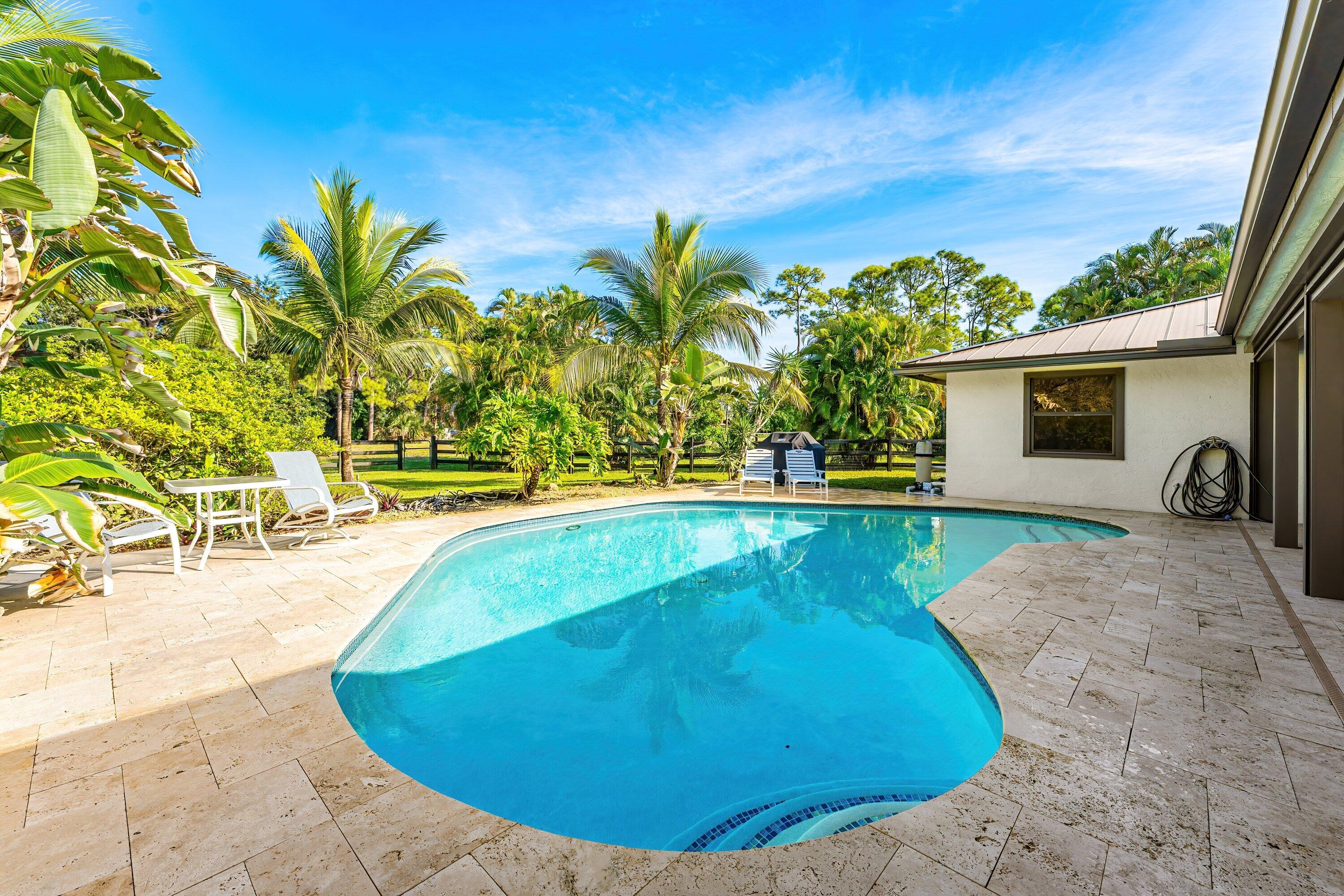 Foto de propiedad en 6799 149th Place N, Palm Beach Gardens, FL 33418 Palm Beach Gardens con MLS# 