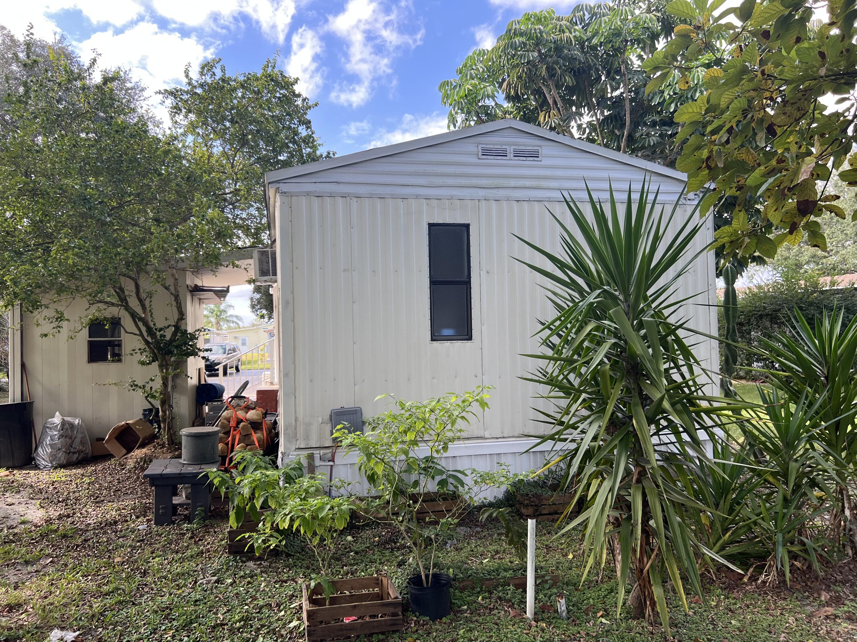 Foto de propiedad en 6730 NW 44th Way Lot T-18, Coconut Creek, FL 33073 Coconut Creek con MLS# 