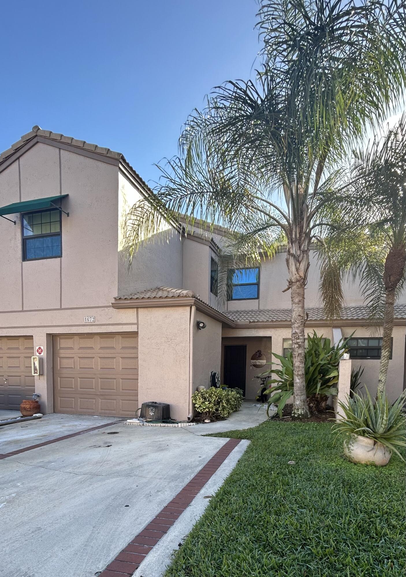 Front of home with attached garage and 2 driveway parking spaces
