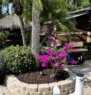 Foto de propiedad en 54 NW Boundary Drive, Port St. Lucie, FL 34986 Port St. Lucie con MLS# 