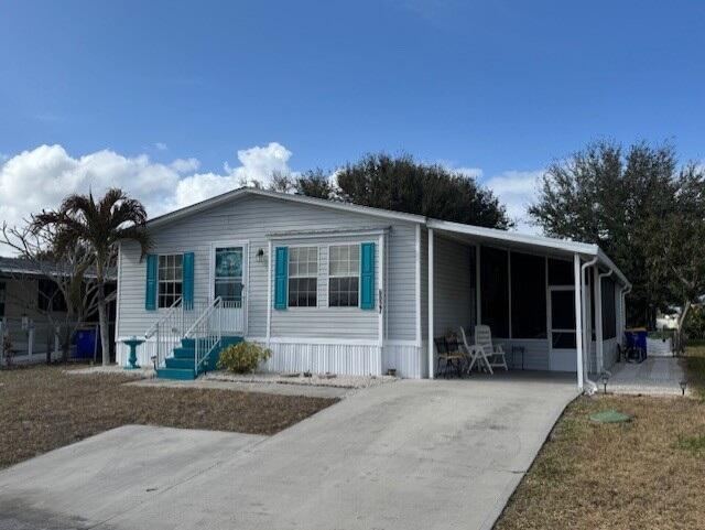 Foto de propiedad en 6927 SE Delegate Street, Hobe Sound, FL 33455 Hobe Sound con MLS# 