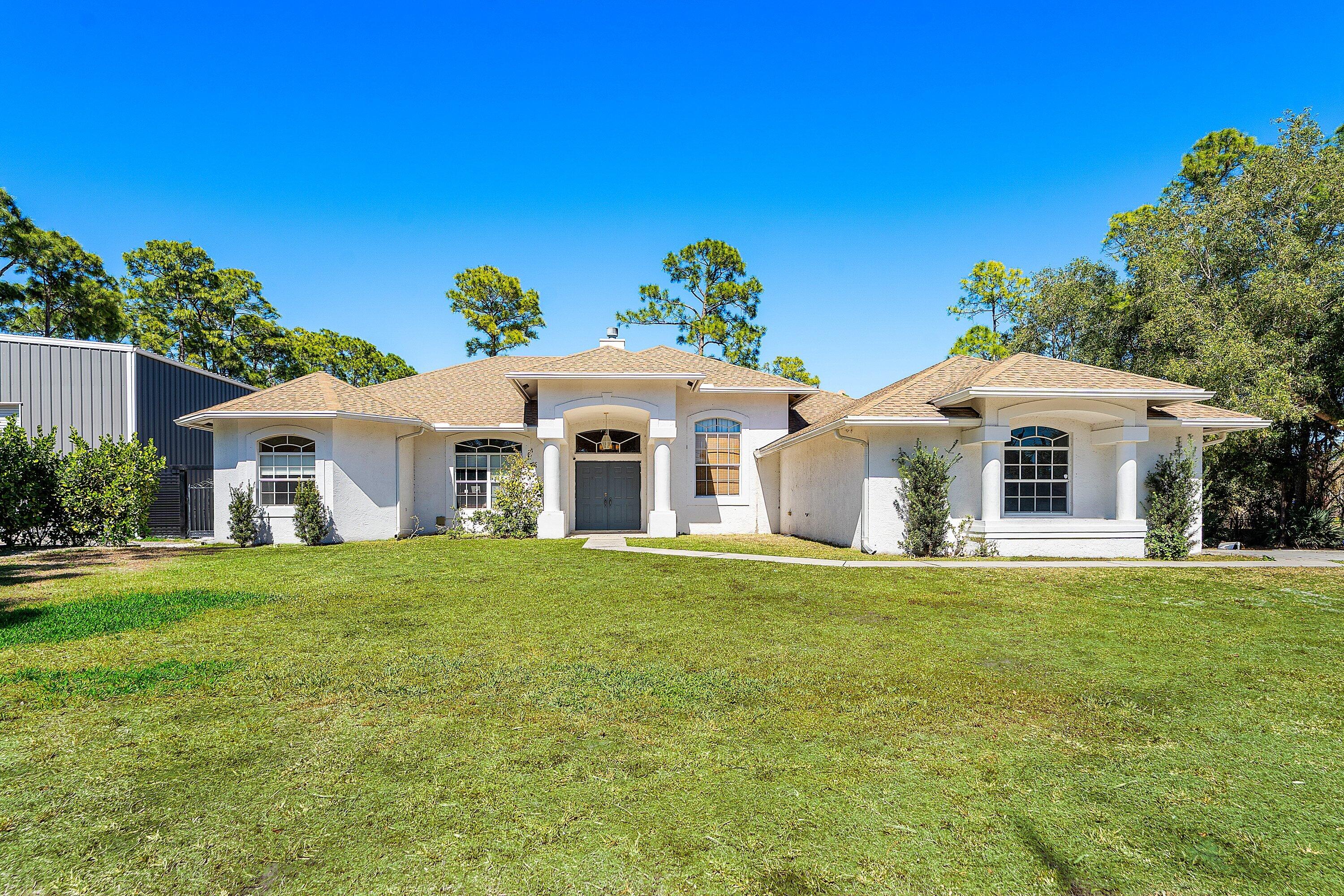 Foto de propiedad en 17225 80th Street N, The Acreage, FL 33470 The Acreage con MLS# 