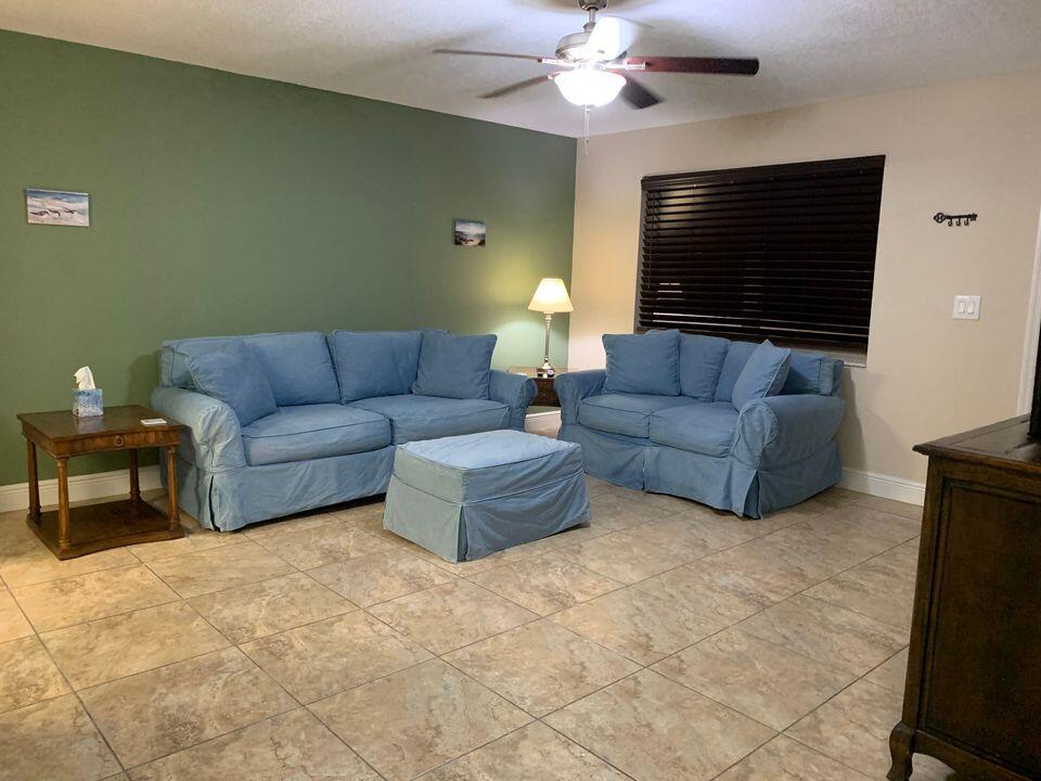 Large open living space with comfortable seating and entertainment.
